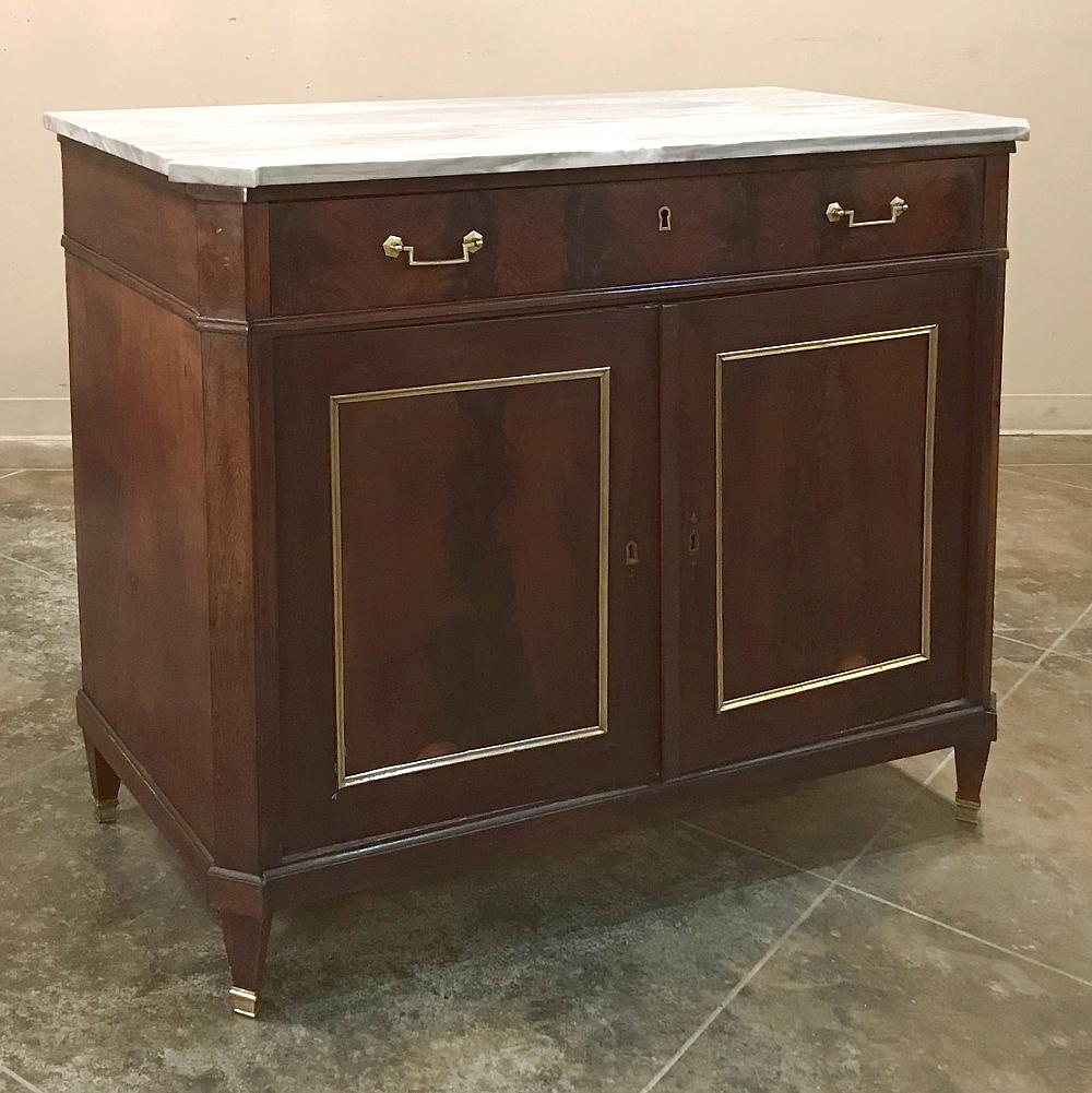 Mid-19th century French Directoire mahogany marble top buffet features tailored lines that have endeared the style to decorators for over two hundred years! Exotic imported mahogany has been highly prized by furniture makers in Europe for the same