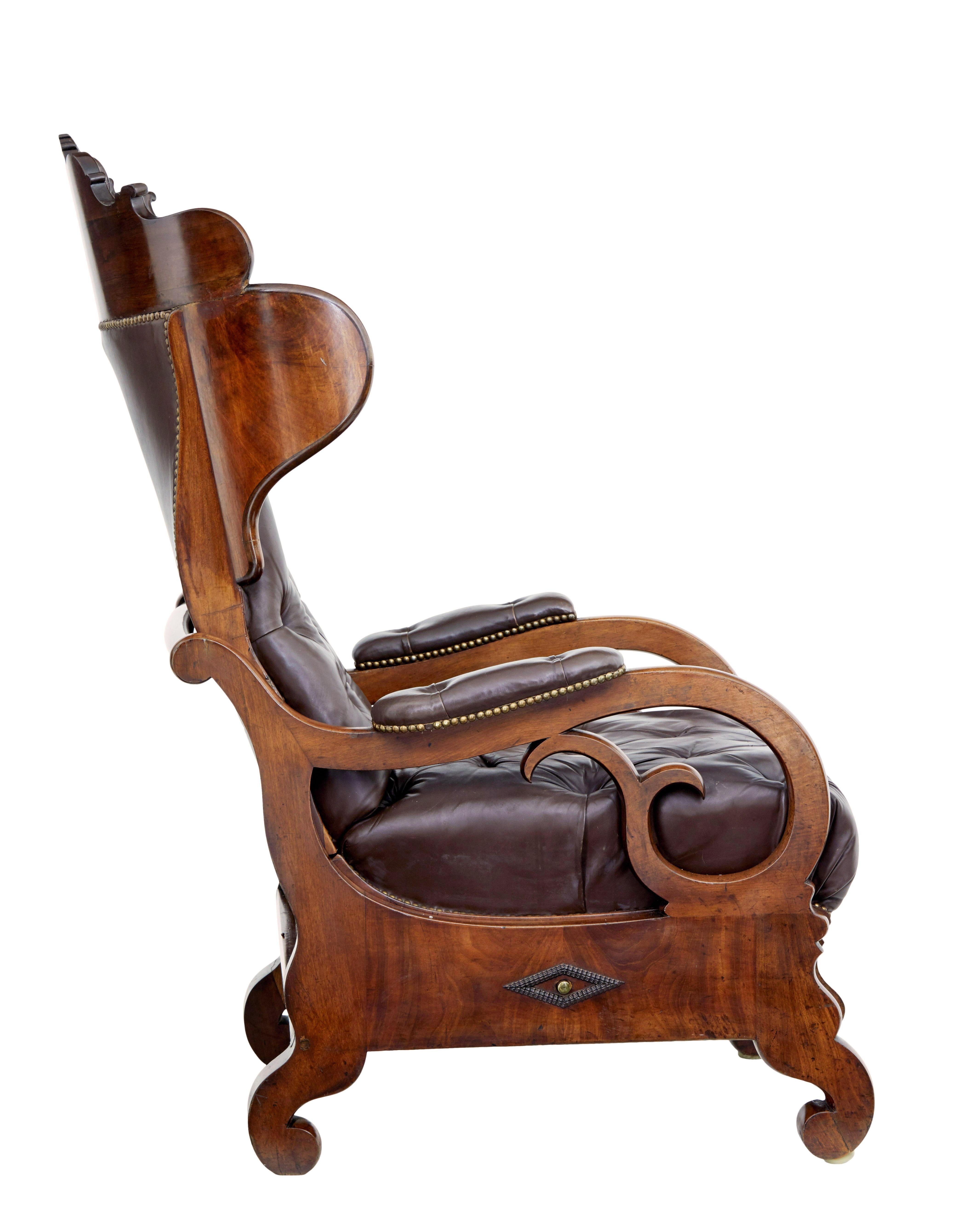 Hand-Carved Mid 19th century French empire mahogany and leather reclining chair For Sale