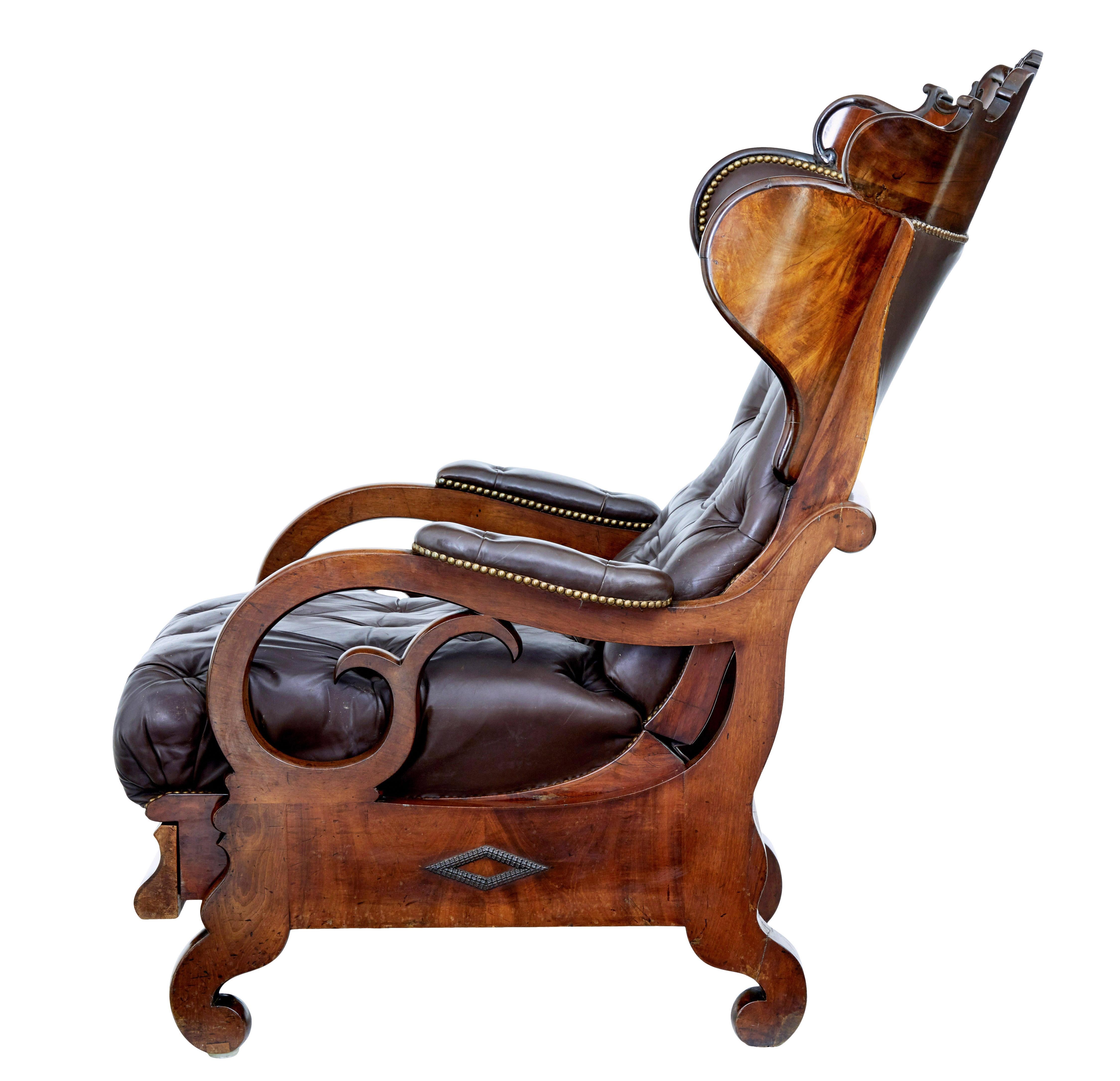 19th Century Mid 19th century French empire mahogany and leather reclining chair For Sale