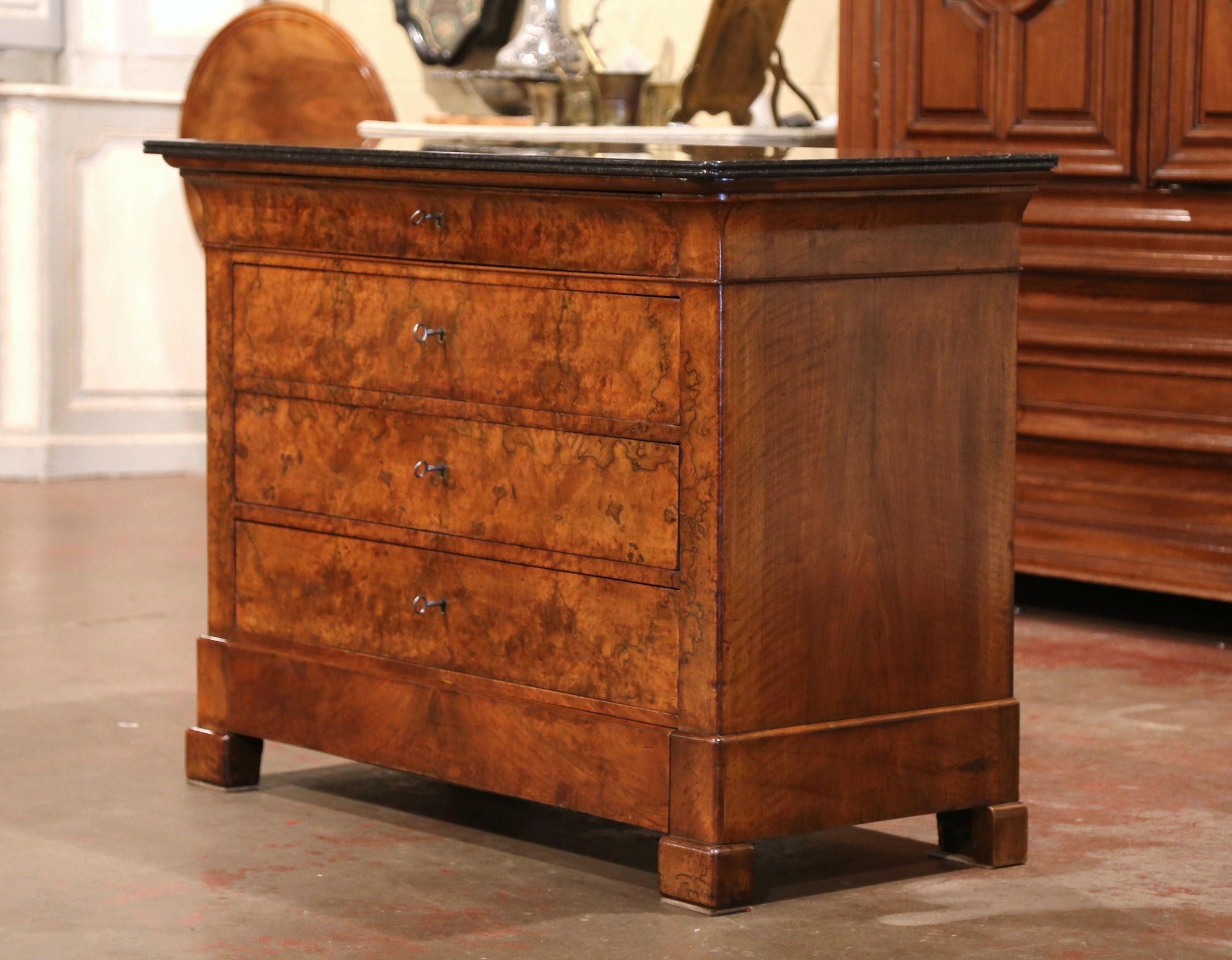 This elegant, antique fruitwood chest of drawers was crafted in France, circa 1860. The traditional commode with simple lines stands on four square feet over a thick and raised base plinth; the cabinet features five long drawers across the front
