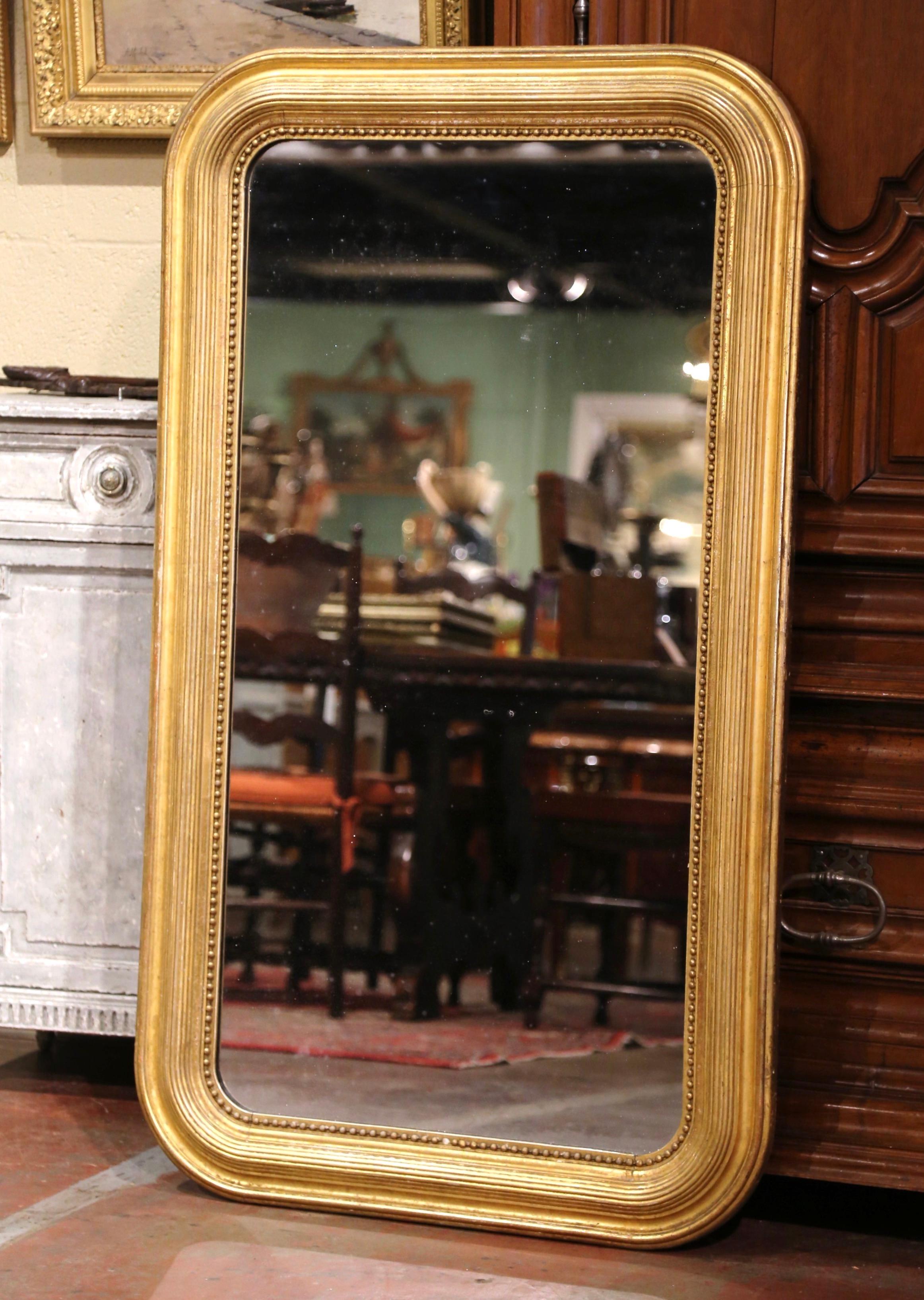 Versatile, this Louis Philippe mirror could be hung horizontally or vertically in a number of rooms for a traditional French style, including over a mantel, or in a horizontal position over a long buffet or console. Crafted in the Burgundy region of