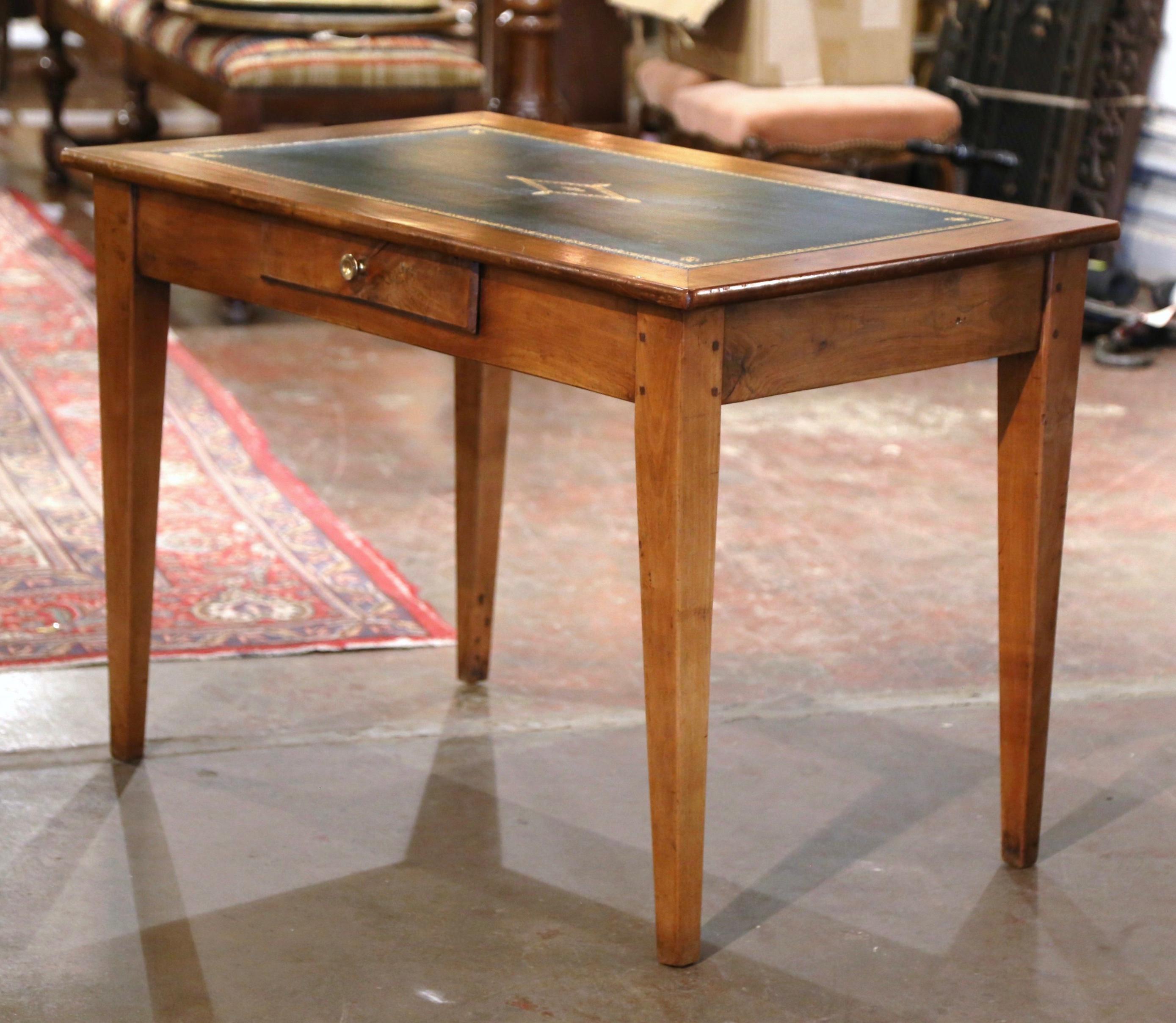 This versatile, antique fruitwood end table could easily be mixed into any room in your home. The simple, traditional Louis Philippe style side table was carved in the Poitou region of France, circa 1860. The small writing table stands on tapered