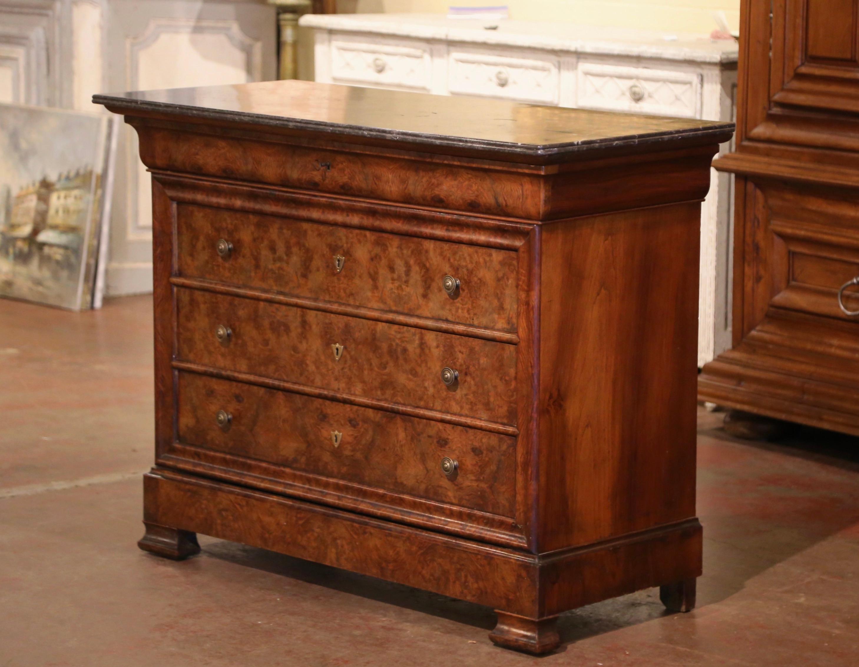 This elegant, antique fruitwood chest of drawers was crafted in France, circa 1870. The traditional commode with simple lines stands on square feet over a thick and raised base plinth; the cabinet features five long drawers across the front