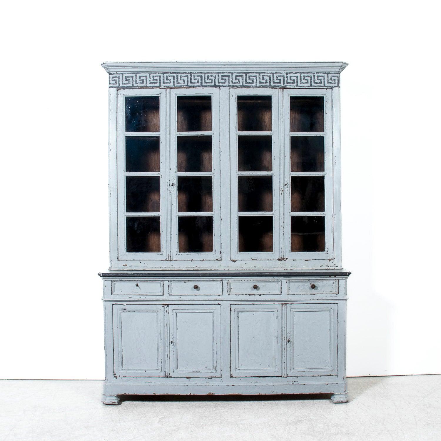Graceful in scale and quietly sophisticated, this large mid-19th century French Louis Philippe period bibliothèque — handcrafted by talented artisans in Avignon, circa 1840s — embodies the restrained refinement that defines the era. The later