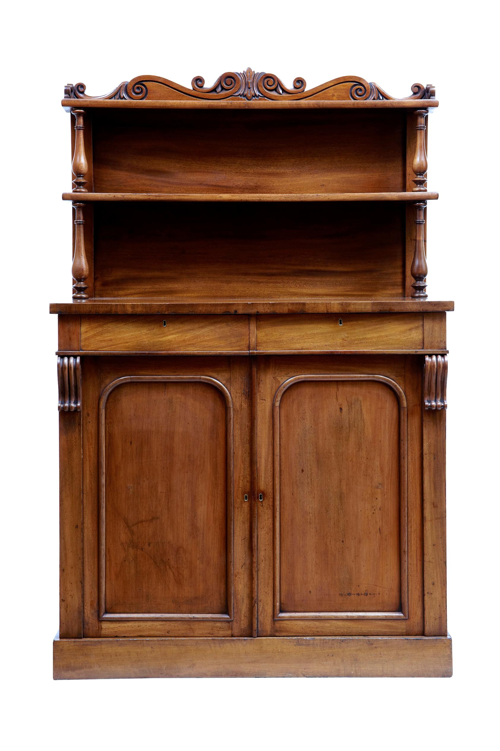 Mid-19th century French mahogany chiffonier sideboard, circa 1840.

Good quality sideboard made in rich mahogany. Top section with carved scroll gallery and 2 shelves supported by turned supports. 2 drawers below the top surface.

Double door