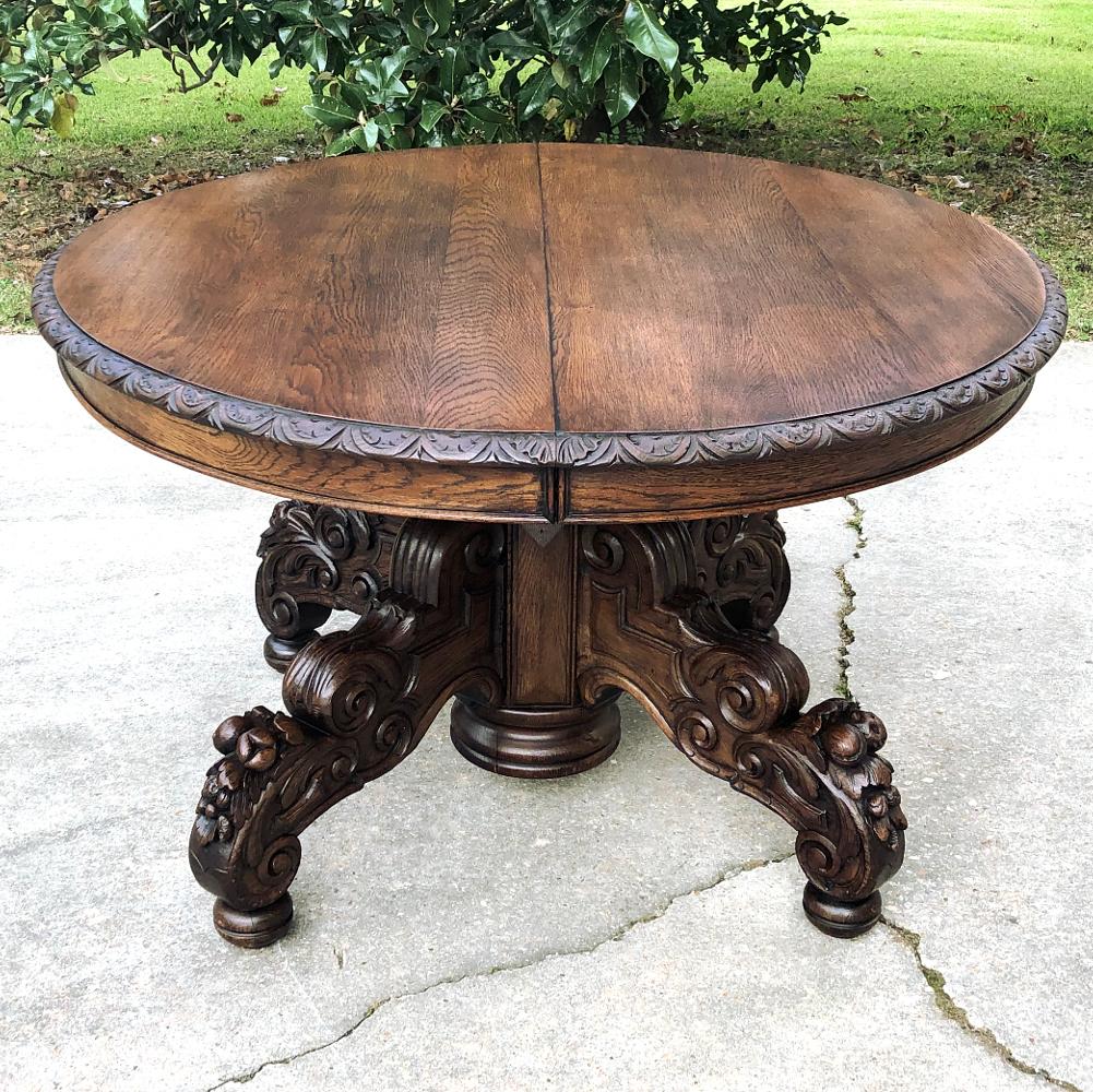 Mid-19th Century French Renaissance oval center table is a splendid example of the genre, completely hand-crafted from old growth oak! The spacious oval top is edged with demilune gadrooning with a fletching and scallop shell motif. Underneath the