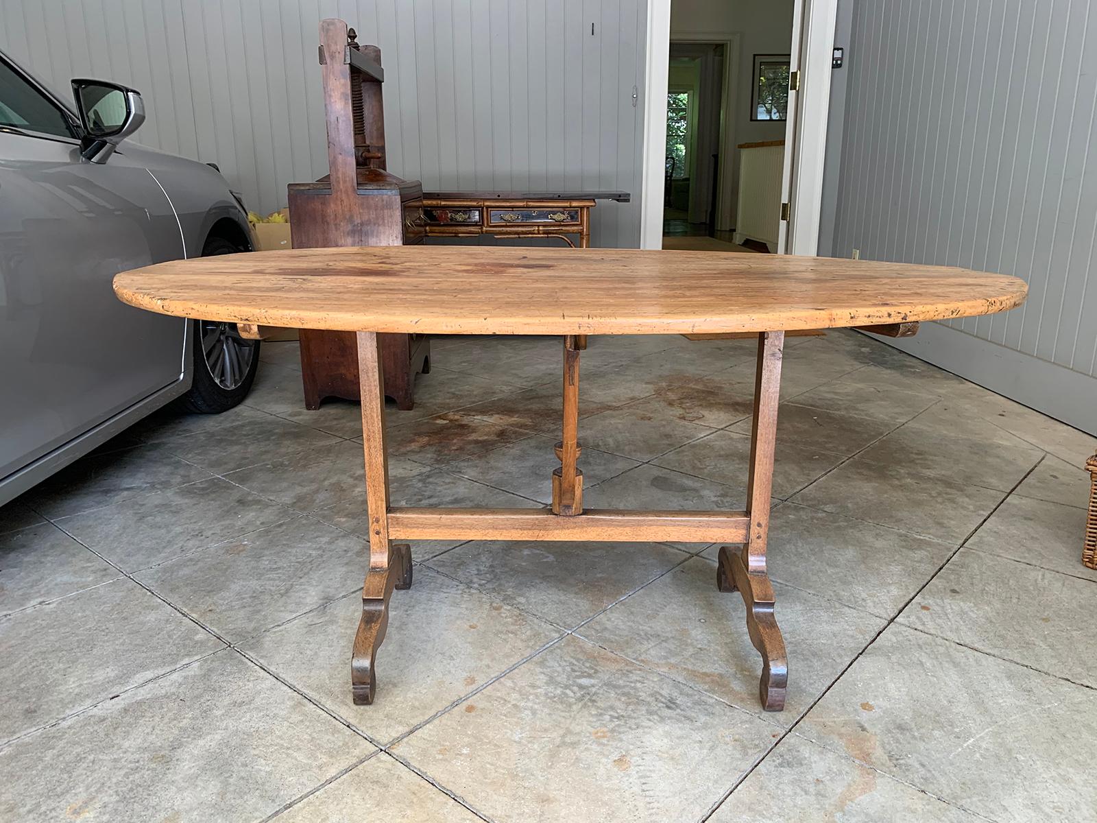 Mid-19th century French rustic oval wine tasting table with trestle base
Apron: 27