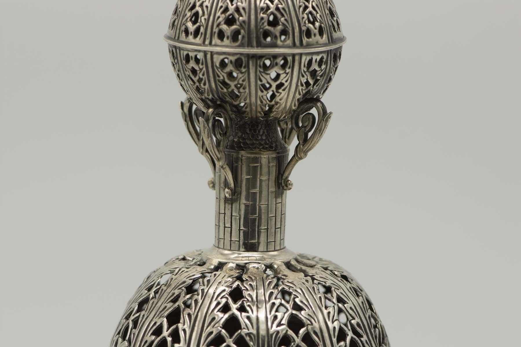 Handmade silver Torah finials, chased, pierced, engraved, and cast, France, circa 1860.
The finials are constructed with large open-work decorated ball in the middle, above it a pole with engraving of bricks and roof tiles, leaf-decorated