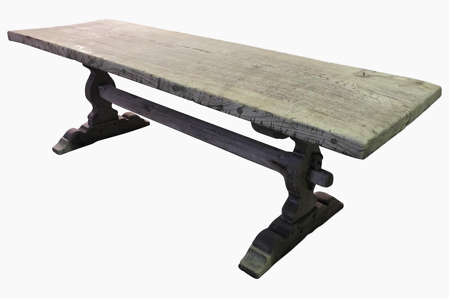 A wonderful mid-19th century farm table - Trestle table from the Provence region of France. Soundly constructed from washed oak with beautifully sculpted legs and a very thick solid board top. Great patina.