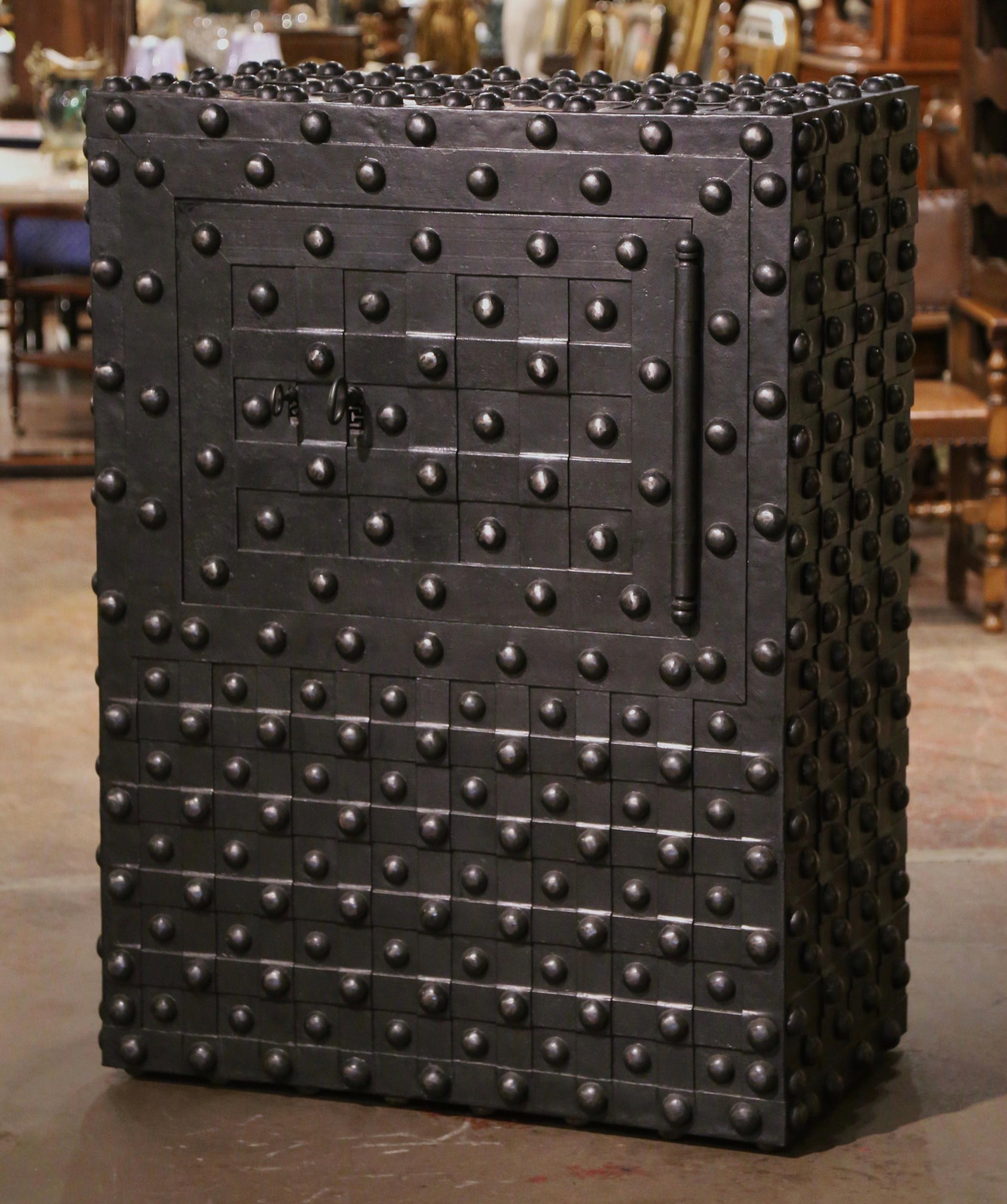 Keep your valuables and important documents in this large antique hobnail safe. Manufactured by Magaud de Charf in Marseilles, France circa 1870, the wrought iron safe is decorated with nail head motifs on all four sides and has an all-original,