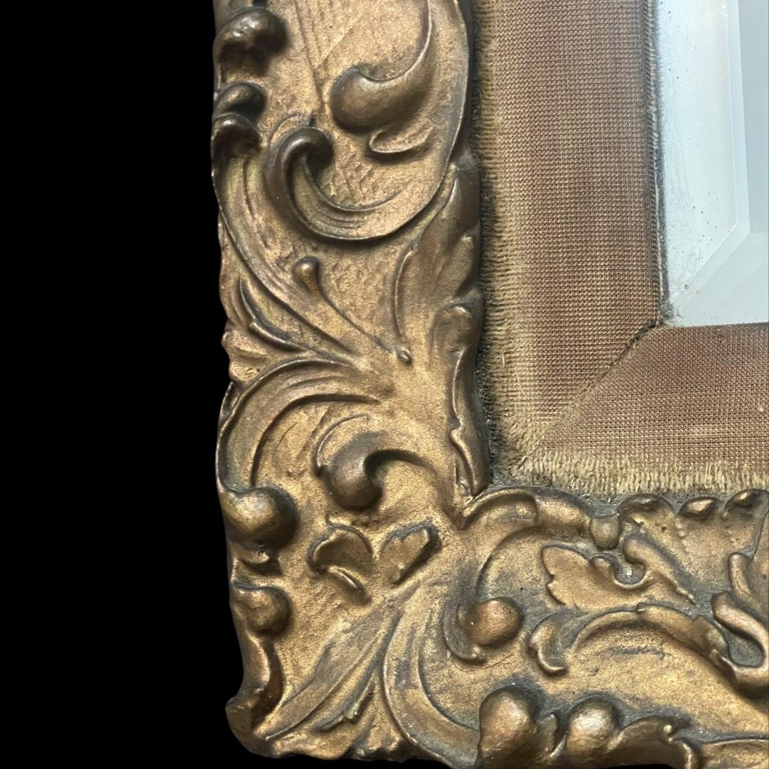 Introducing a captivating mid-19th century gesso wooden gilded wall mirror of exquisite French origin.

 This timeless piece exudes elegance with its intricate craftsmanship and historical significance. The mirror's inner layer, once graced by