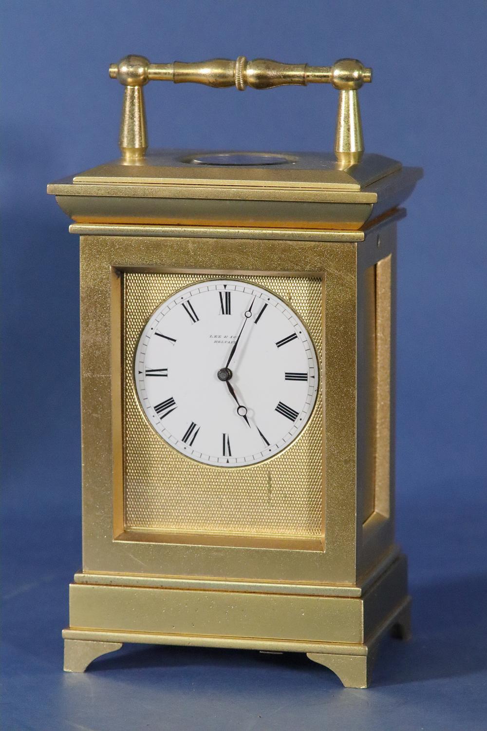 Lee & Son, Belfast – Retailer
 
The very heavy gilt-bronze case has a bollard handle, a glass viewing panel above, is stamped 1522 and has a pinned back door with the release on the bottom of the case.

The finely lettered white porcelain dial