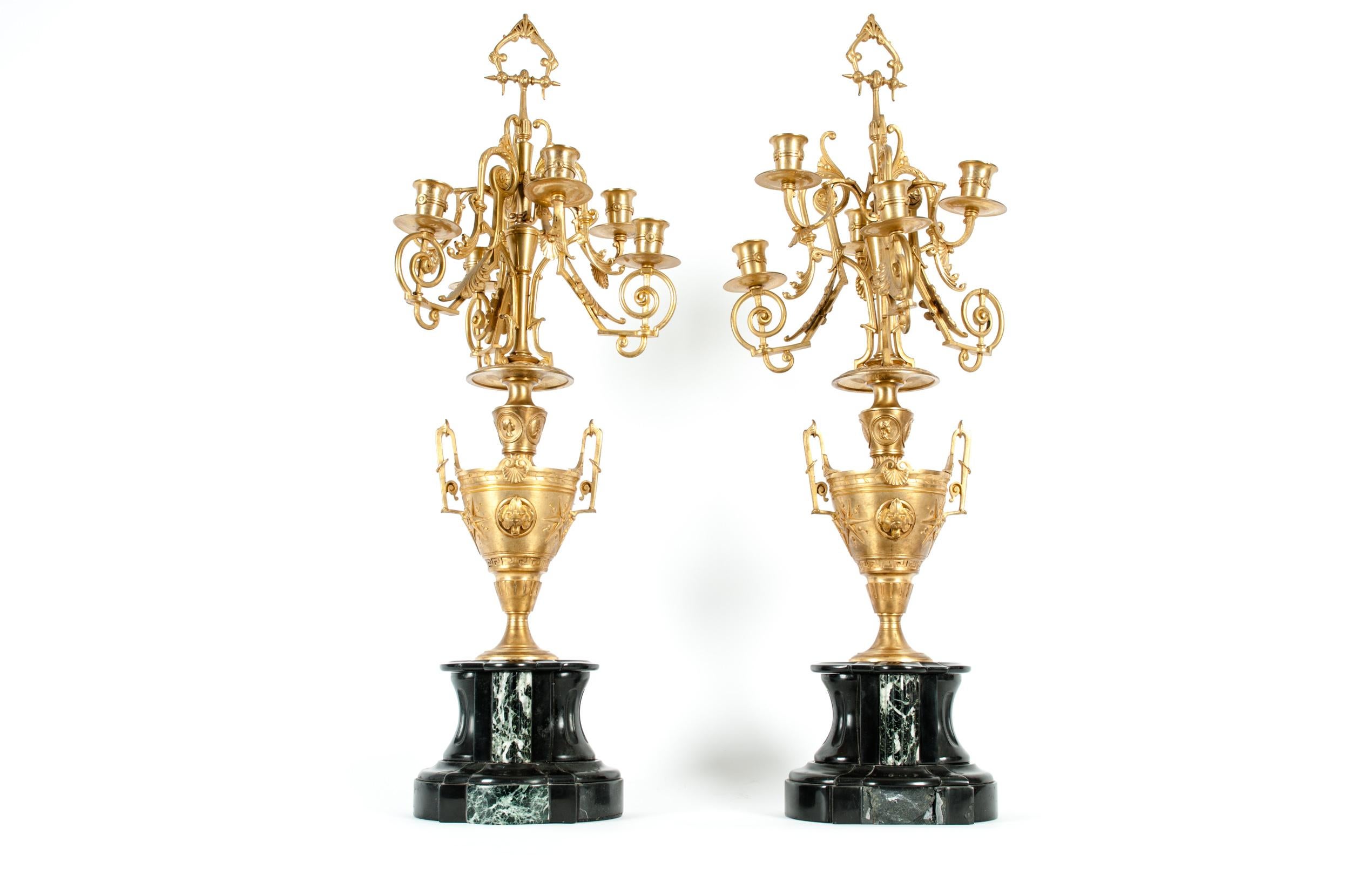Mid-19th century gilt bronze five arms candelabra with black slate holding base. Each candelabra is in great antique condition with wear appropriate to age / use. Each candelabra measure about 29 inches high x 11 inches diameter.