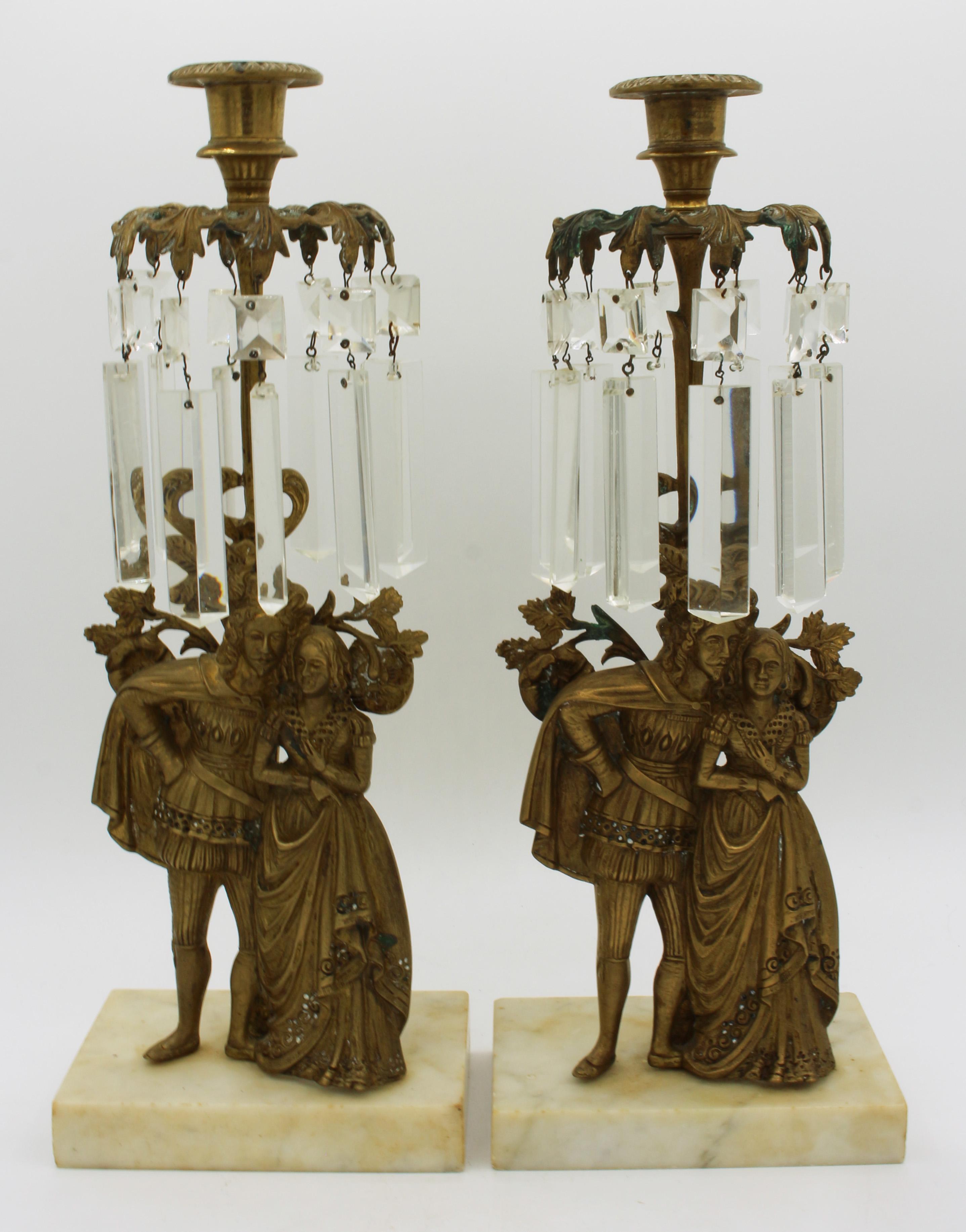 A pair of gilt bronze girandoles on marble bases. c.1850-65. Featuring an elegant young woman in elaborate gown with fan. Cut crystal (a few chips) often associated with several Philadelphia makers. Marble bases with typical chipping. Measures: 15