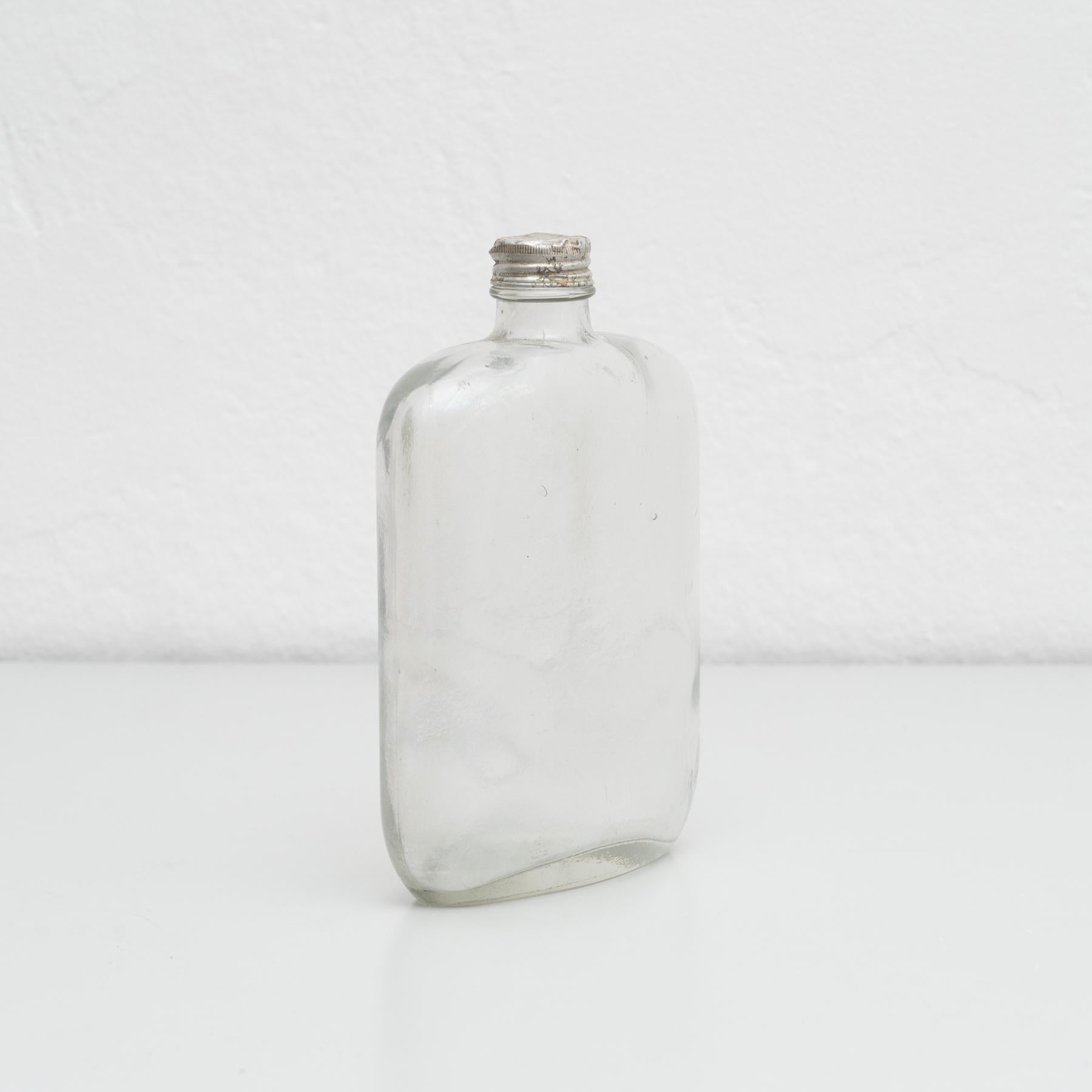 Early 20th Century Mid-19th Century Glass Bottle with Metal Cap For Sale