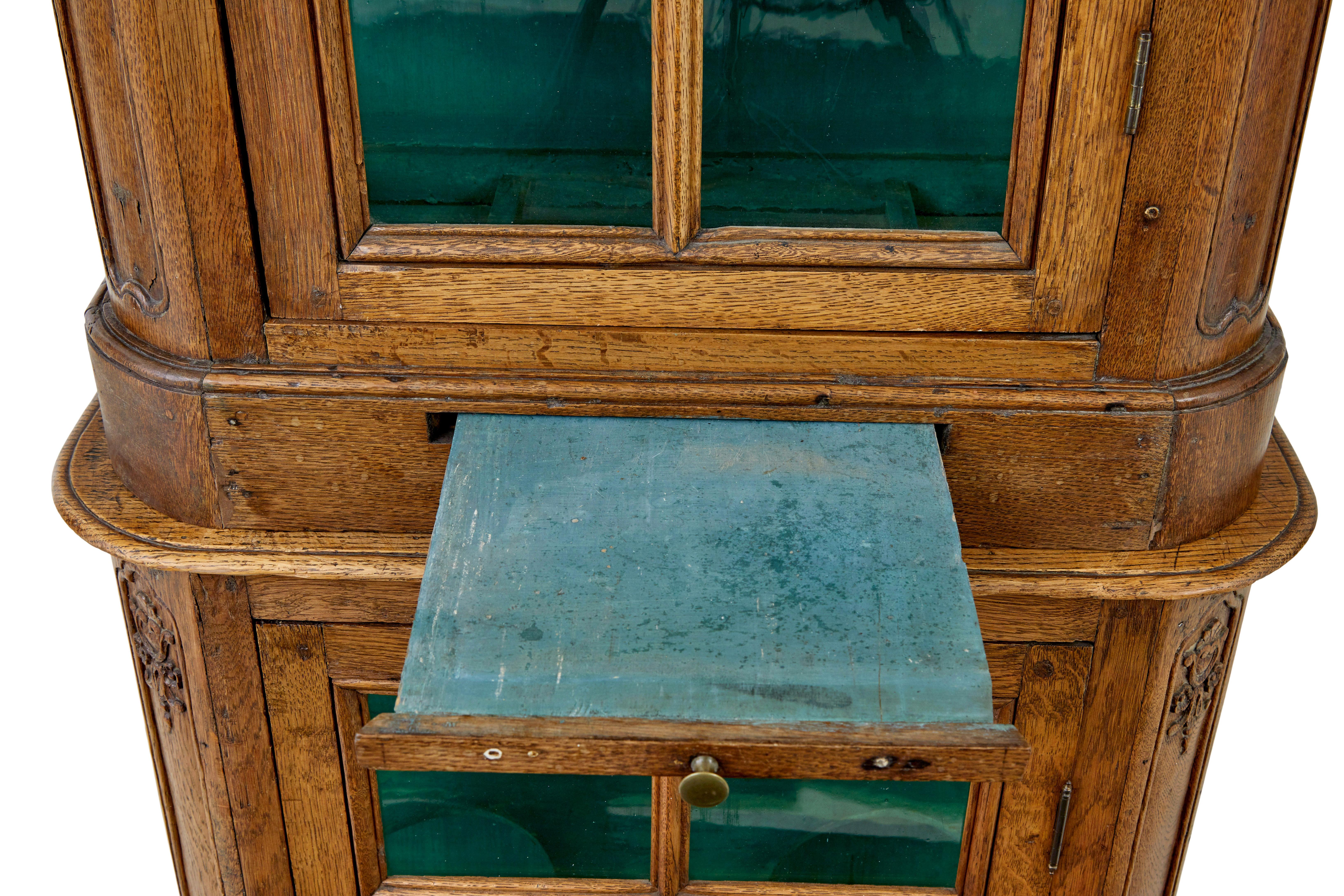 19th Century Mid 19th century glazed carved oak liège cabinet For Sale