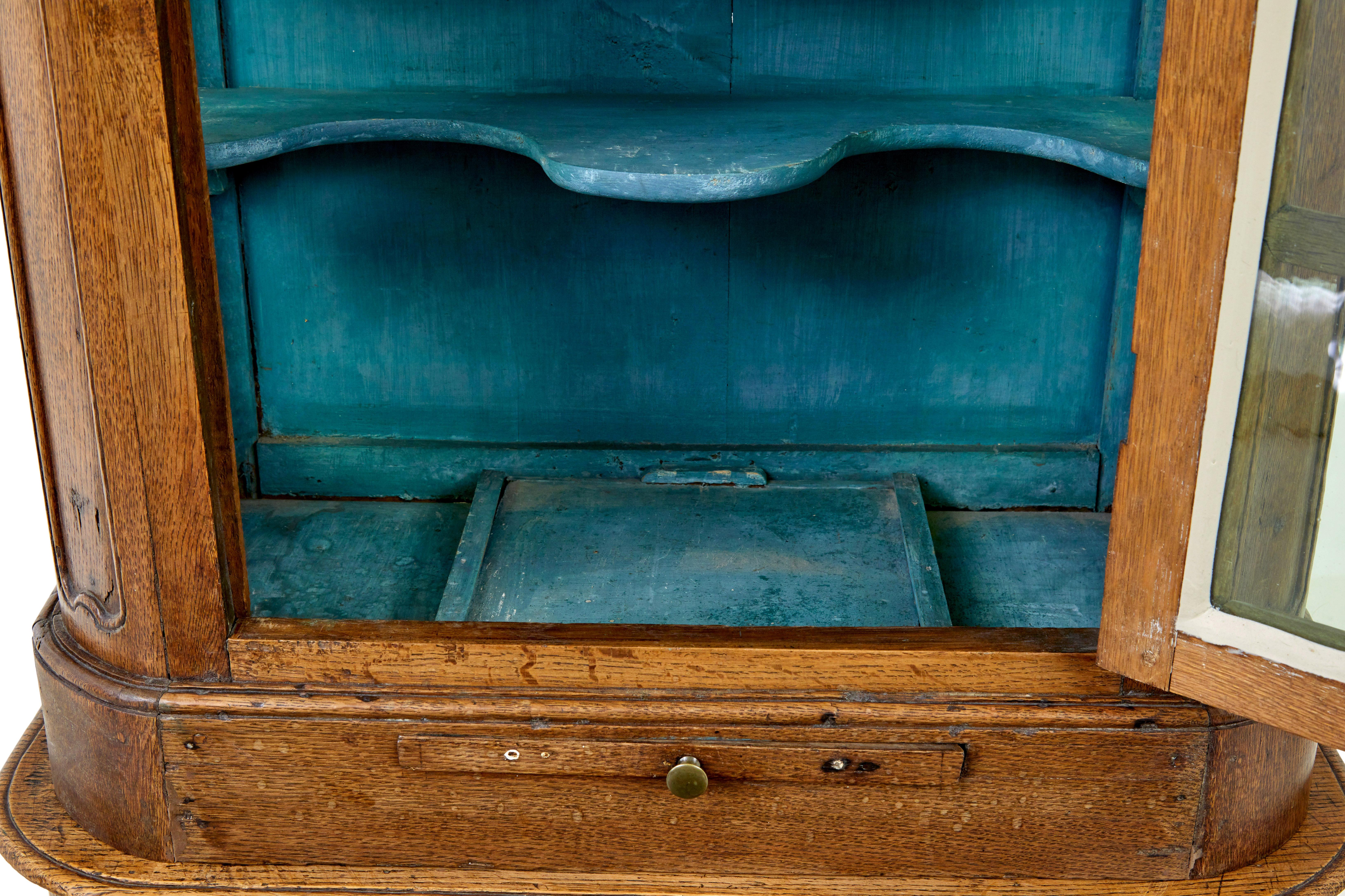 Glass Mid 19th century glazed carved oak liège cabinet For Sale