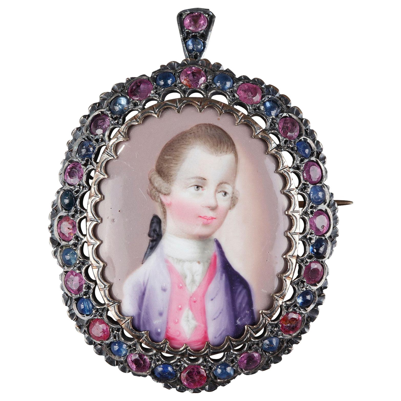 Mid-19th Century Gold Pendant with Miniature, Sapphires and Rubies For Sale