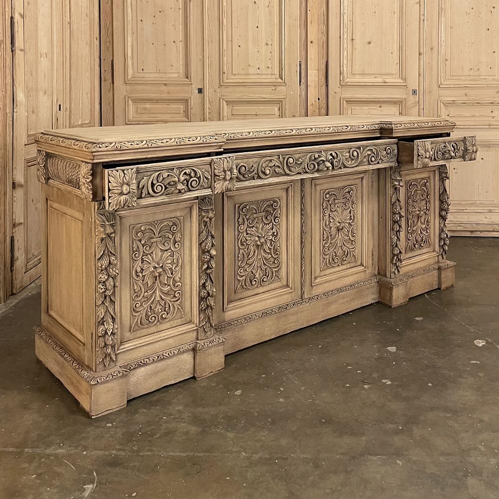 Mid-19th century Grand French Renaissance low buffet in stripped oak is an incredible example of the height of the revival during this important period in French history! Created from solid, dense, old-growth French white oak, it features a