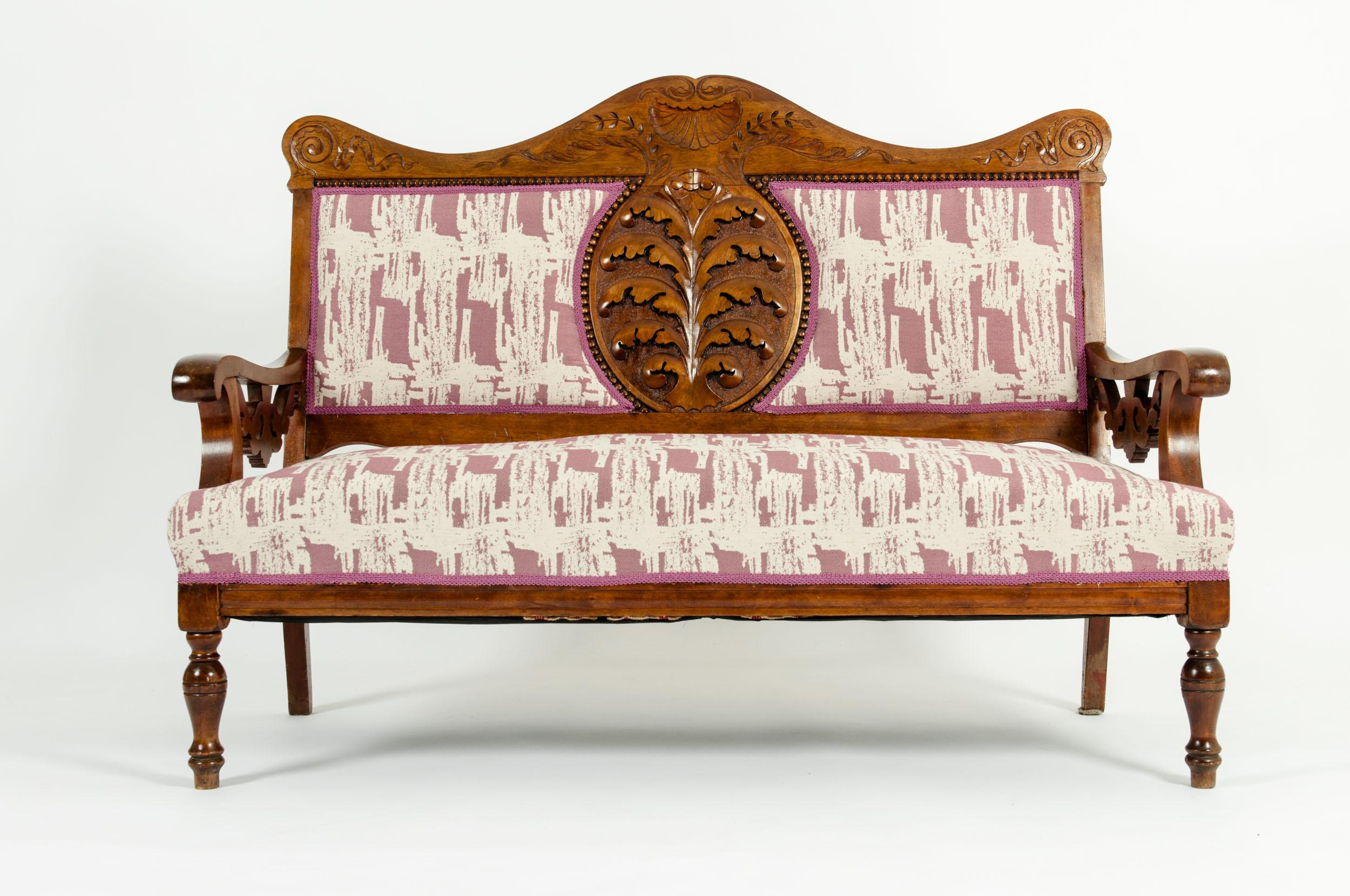 Mid-19th century hand carved mahogany Victorian style settee. The settee is in great antique condition with appropriate wear consistent with age / use. The upholstery is very immaculate. The settee measure about 37 inches high x 51 inches width x 22