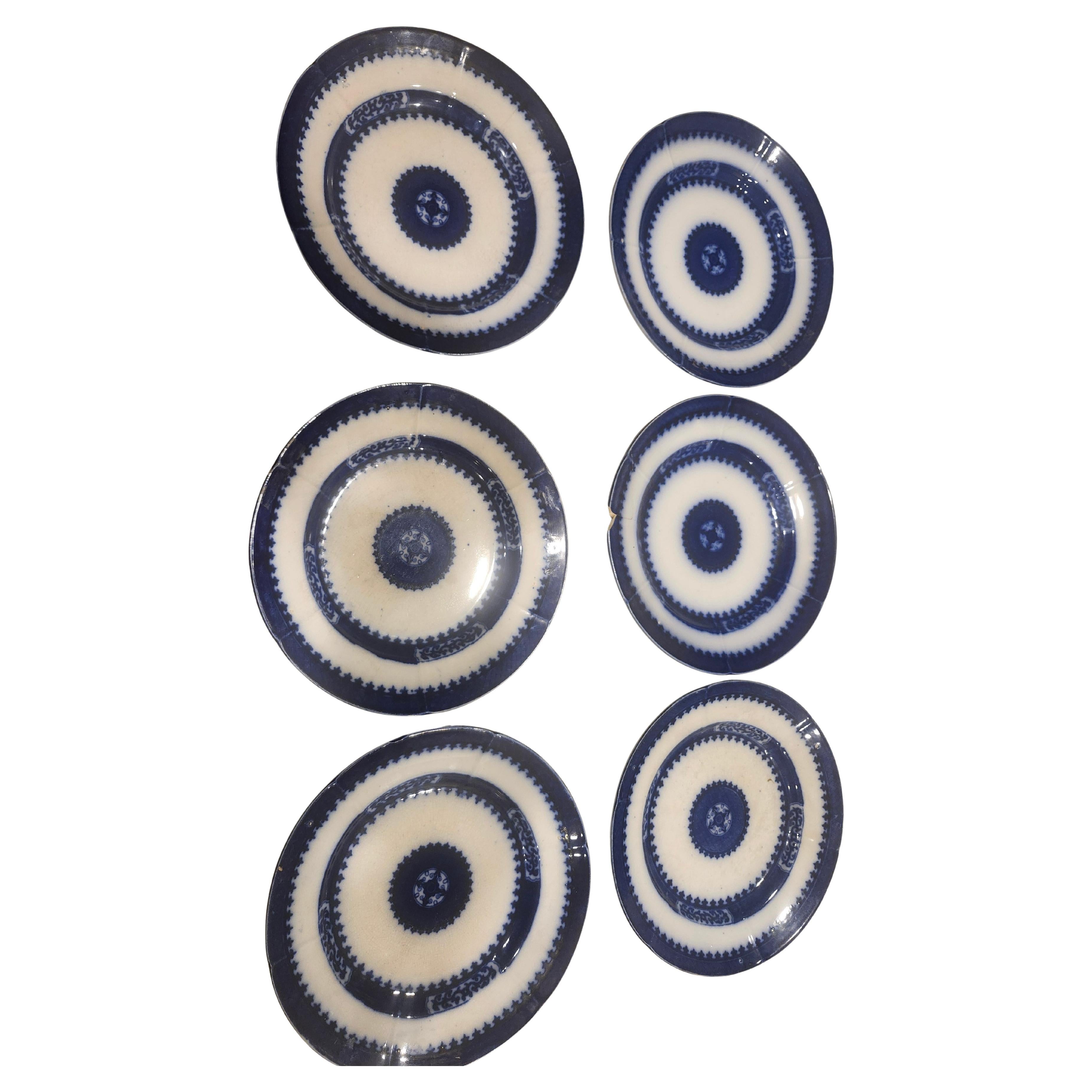 Mitte des 19. Jahrhunderts Hand Crafted Flow Blue Ironstone Satz 9 tief Mittagessen Teller Nankin im Angebot