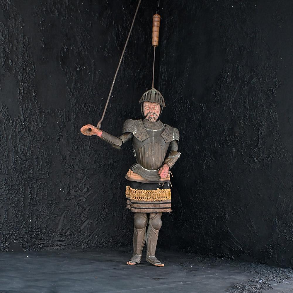 Mid-19th Century Handcrafted Sicilian Marionette Knight 
A mid to late 19th Century hand carved Sicilian marionette knight puppet. Still wearing all in brass armour and silk clothing. Made from carved pine sections and full articulated. Likely to