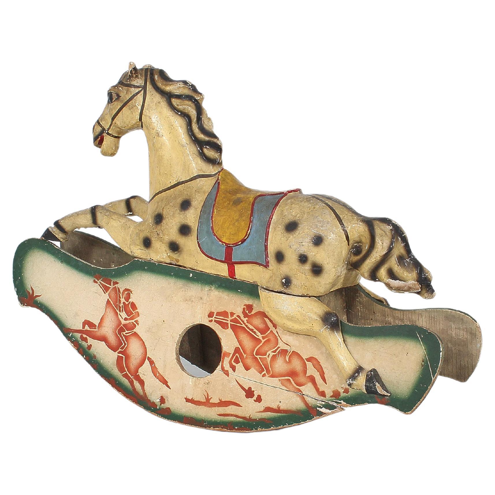 Beautiful handmade rocking horse with metal rod frame covered with a painted and hand-decorated papier-mâché shape. The base is in shaped wood, decorated by hand. Valuable Italian manufacture from the first half of the 19th century.
Wear consistent