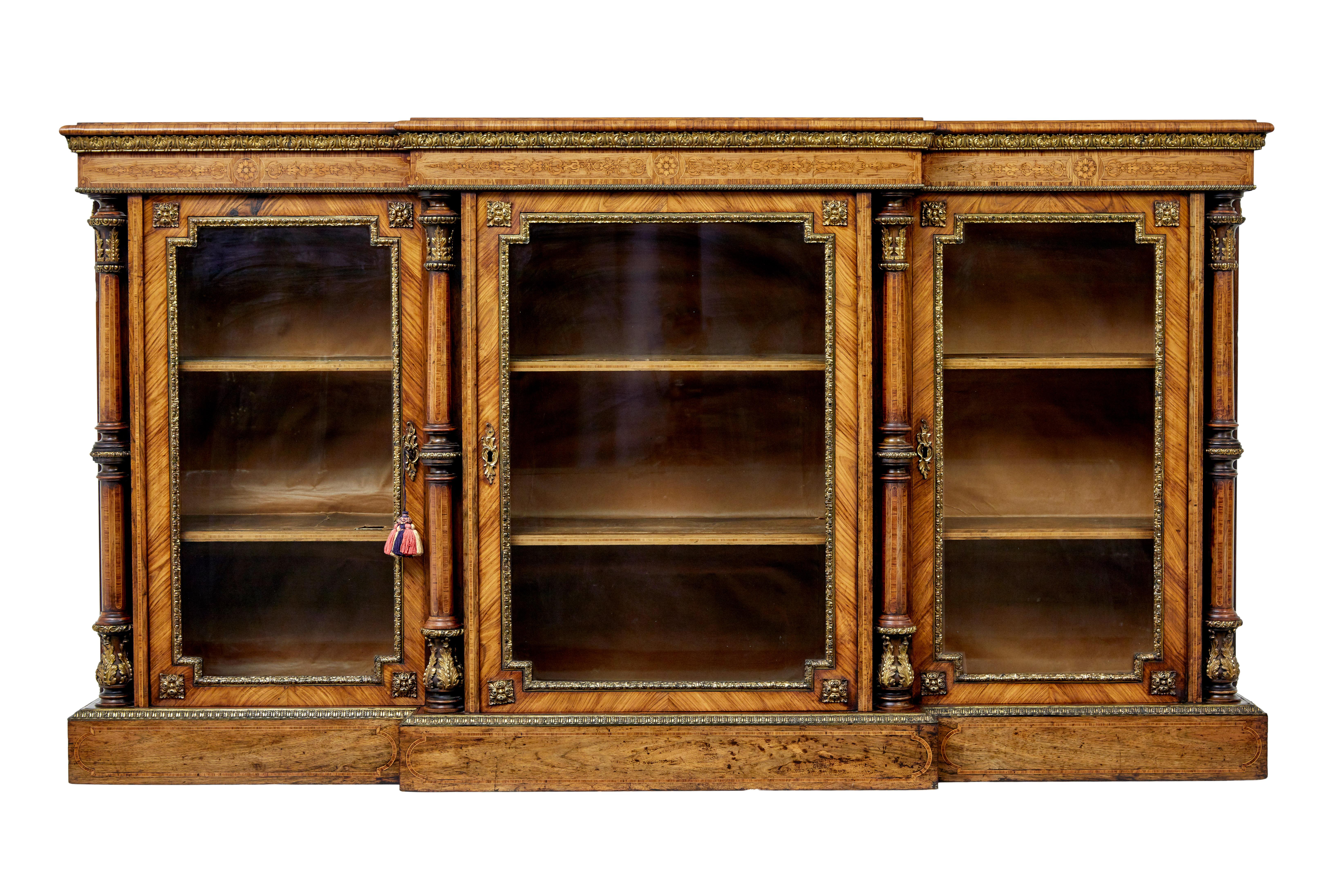 Mid 19th century inlaid walnut breakfront credenza sideboard circa 1850

We are pleased to offer this stunning profusely inlaid sideboard. Breakfront shaped and offering 3 glazed doors for display and storage.

Burr walnut top surface, decorated