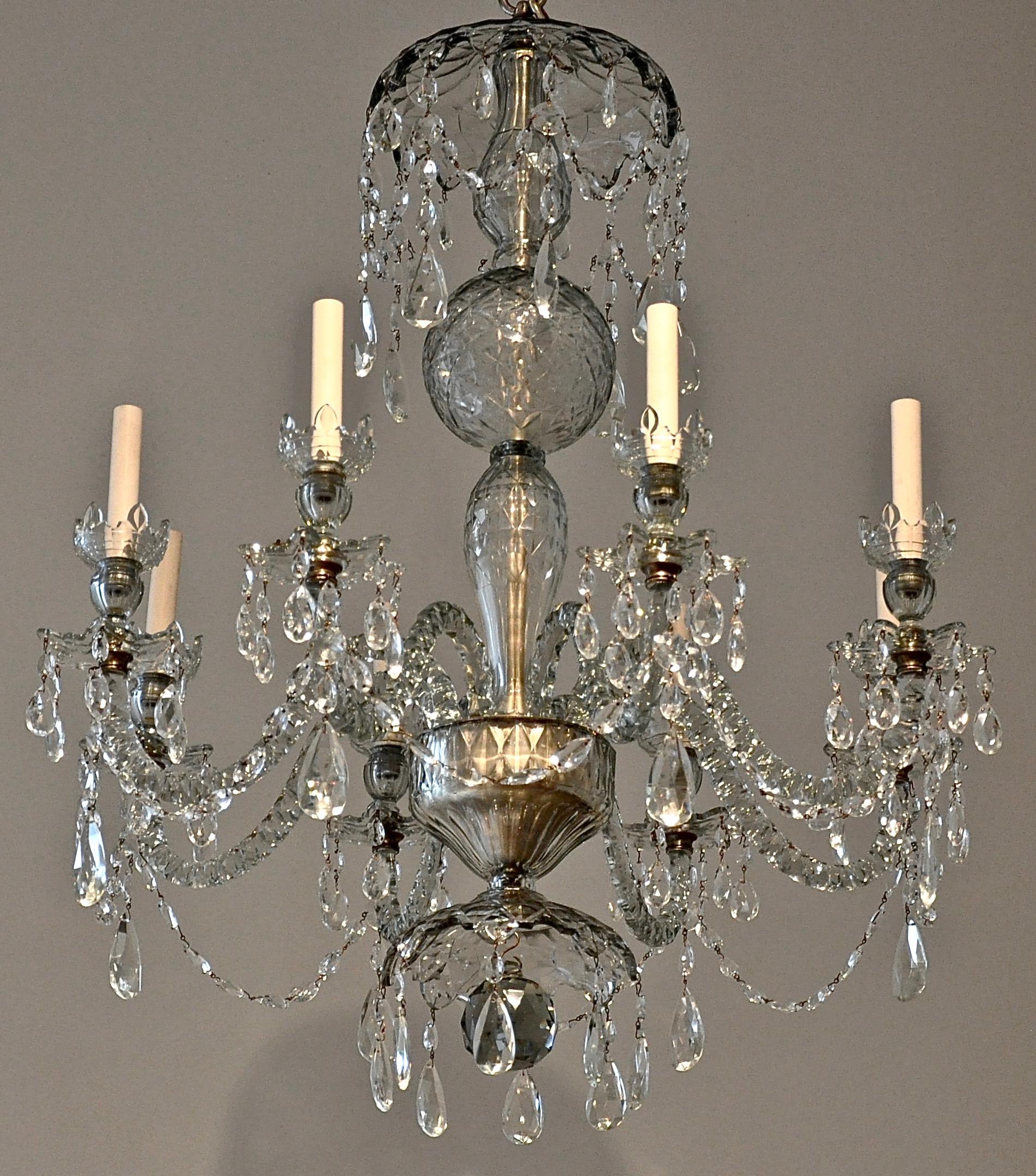 Mid-late 19th century Georgian style crystal chandelier.

-- County Cork Ireland
-- Bright cut crystal in period late 18th century fashion
-- Solid arms
-- No restorations
-- French wired.

Provenance: Charles J. Winston & Co., New York,
