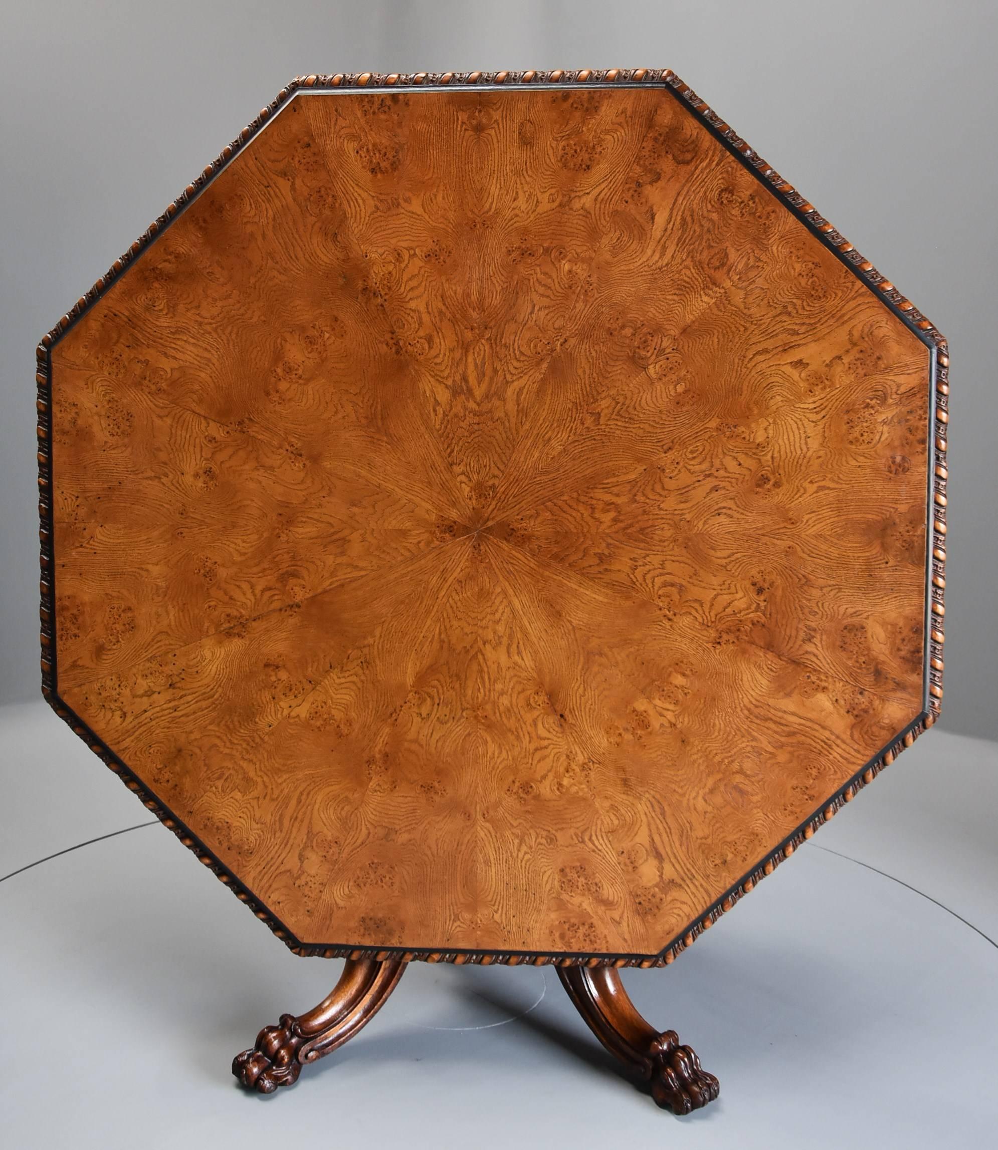 A superb mid-19th century Irish pollard oak octagonal tilt-top centre table.

The table consists of a segmented pollard oak veneered octagonal top with ebonised moulded edge leading to a gadrooned and berry carved moulded edge with an oak veneered