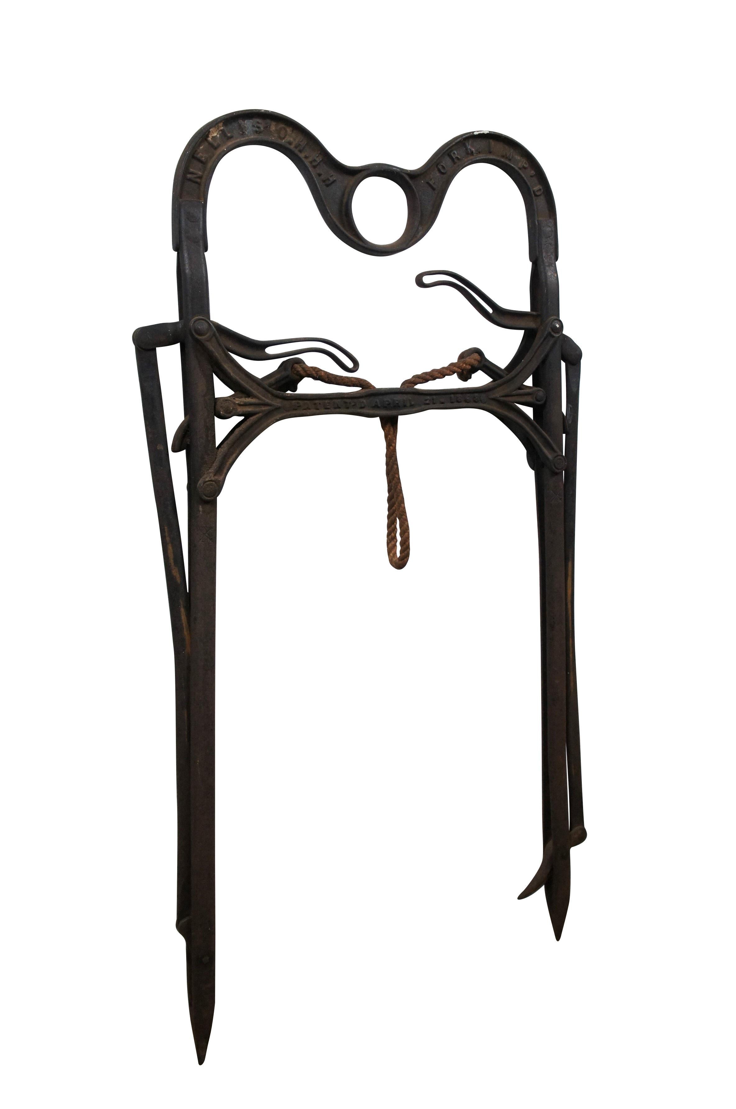 Mid 19th century cast iron hay grapple by A.J. Nellis of Pittsburgh, Pennsylvania, designed to be hung with a pulley /and run along a trolley track to move bales of hay. Marked NELLIS' O.H.H.H. FORK. IMP'D. Patented April 21, 1863.

Dimensions:
21