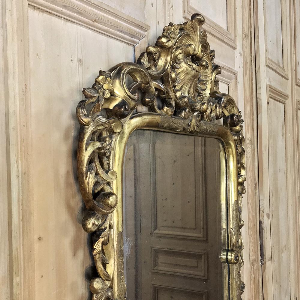 Mid-19th Century Italian Baroque Giltwood Mirror is a wonderfully well-preserved example of the master Italian sculptor's work!  Intricate scroll, shell, foliate and floral motifs abound around the entire framework, pierce-carved (which is the most