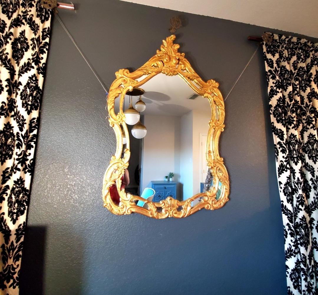 Solid carved wood antique baroque mirror.
Could be French.
Gold gilding.
Statement piece.
Lights up a room.
I'm not certain of the actual age.
I based it off 2 identical mirrors I found online.
It is very old.
Very solid and heavy. 