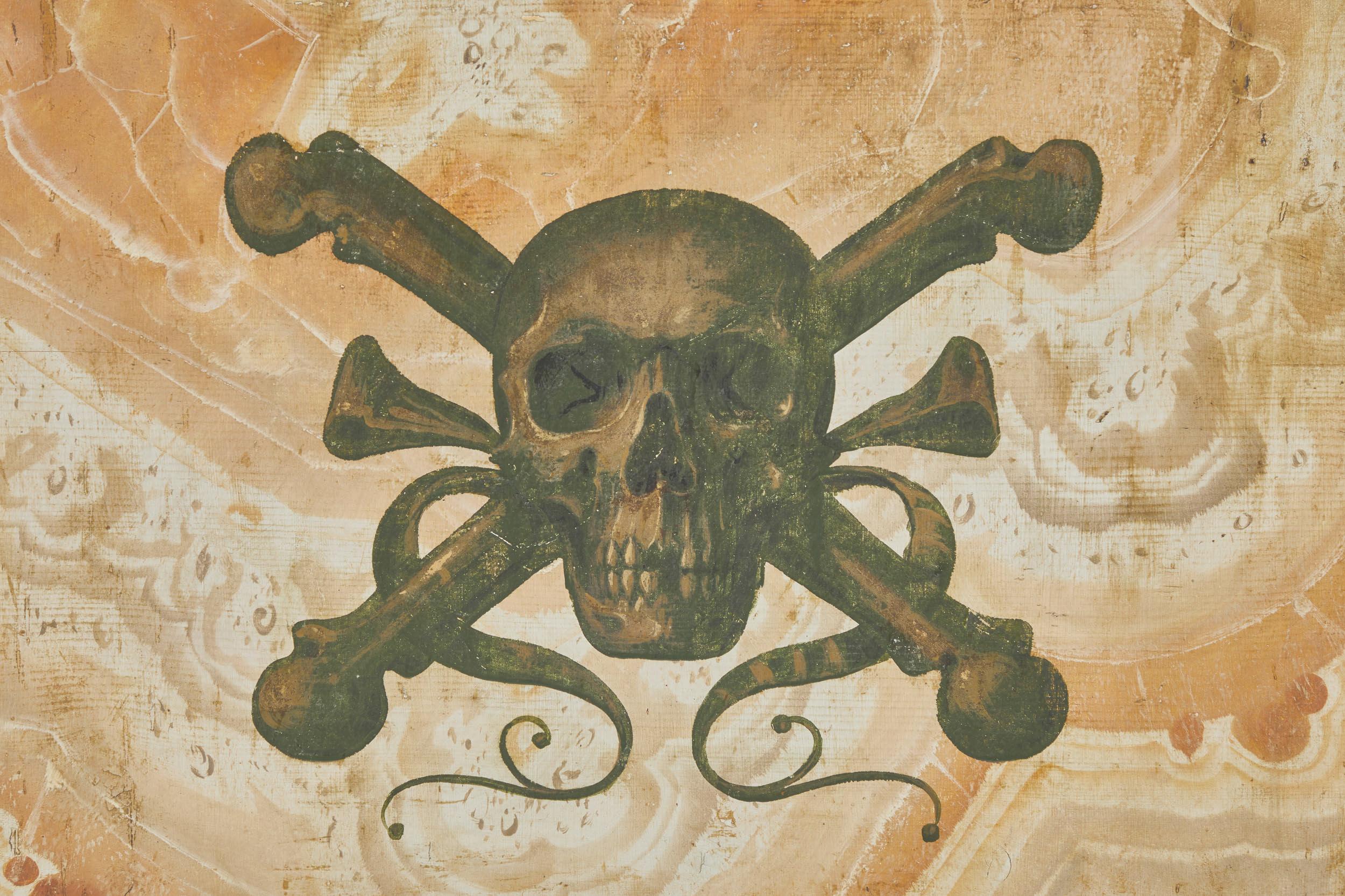 A mid-19th century painted Memento Mori panel with skull and cross bones over a faux painted marbleized background and border. 