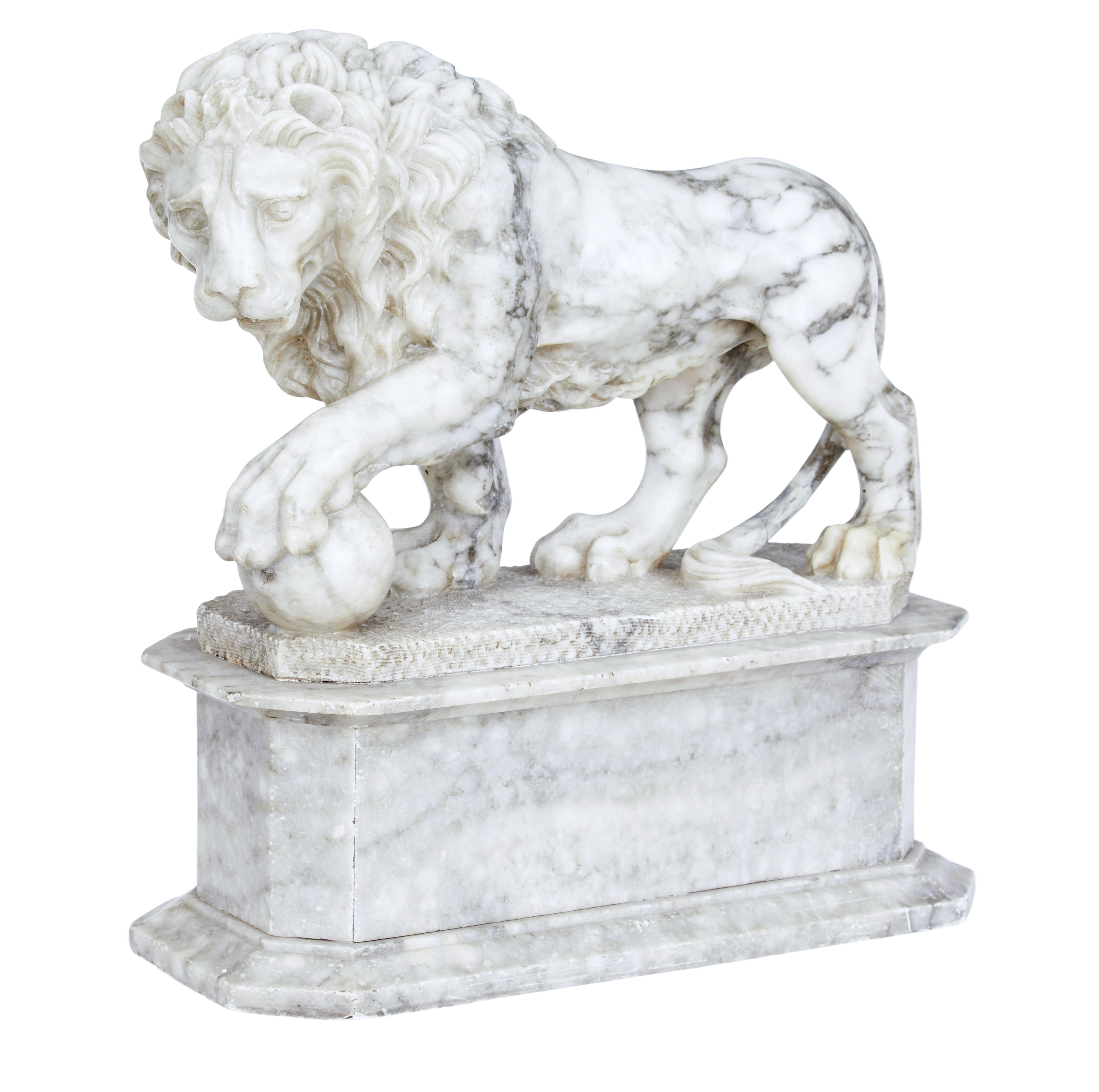 Mid 19th century Italian grand tour marble statue, circa 1860.

Fine quality white marble with grey veining carved lion with 1 foot on a ball. The lion is in a standing position with the ball re-presenting the world.

Standing on an