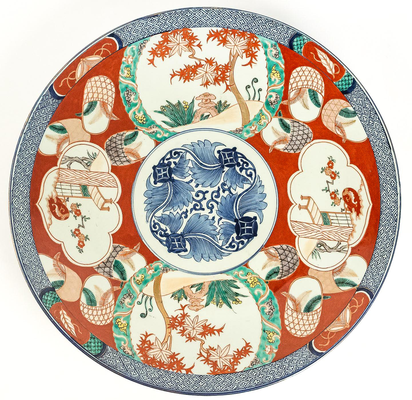 Mid-19th century Japanese polychrome porcelain, magnificent round dish.

A magnificent polychrome Japanese porcelain plate, hand painted in a red, depicting flowers all around the center.

Beautiful Japanese work, mid-19th-century, circa