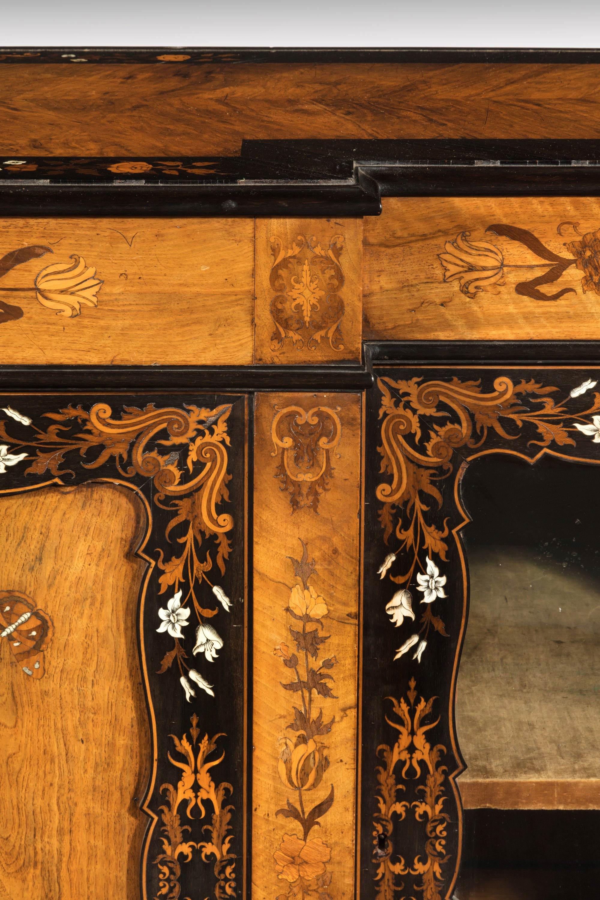 A quite exceptional 19th century Kingwood breakfront side cabinet with beautifully applied marquetry decoration in exotic timbers. In an entirely original and unrestored condition.