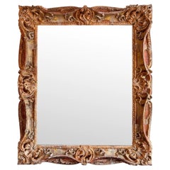 Grand miroir sculpté du milieu du 19e siècle avec finition polychrome vieillie