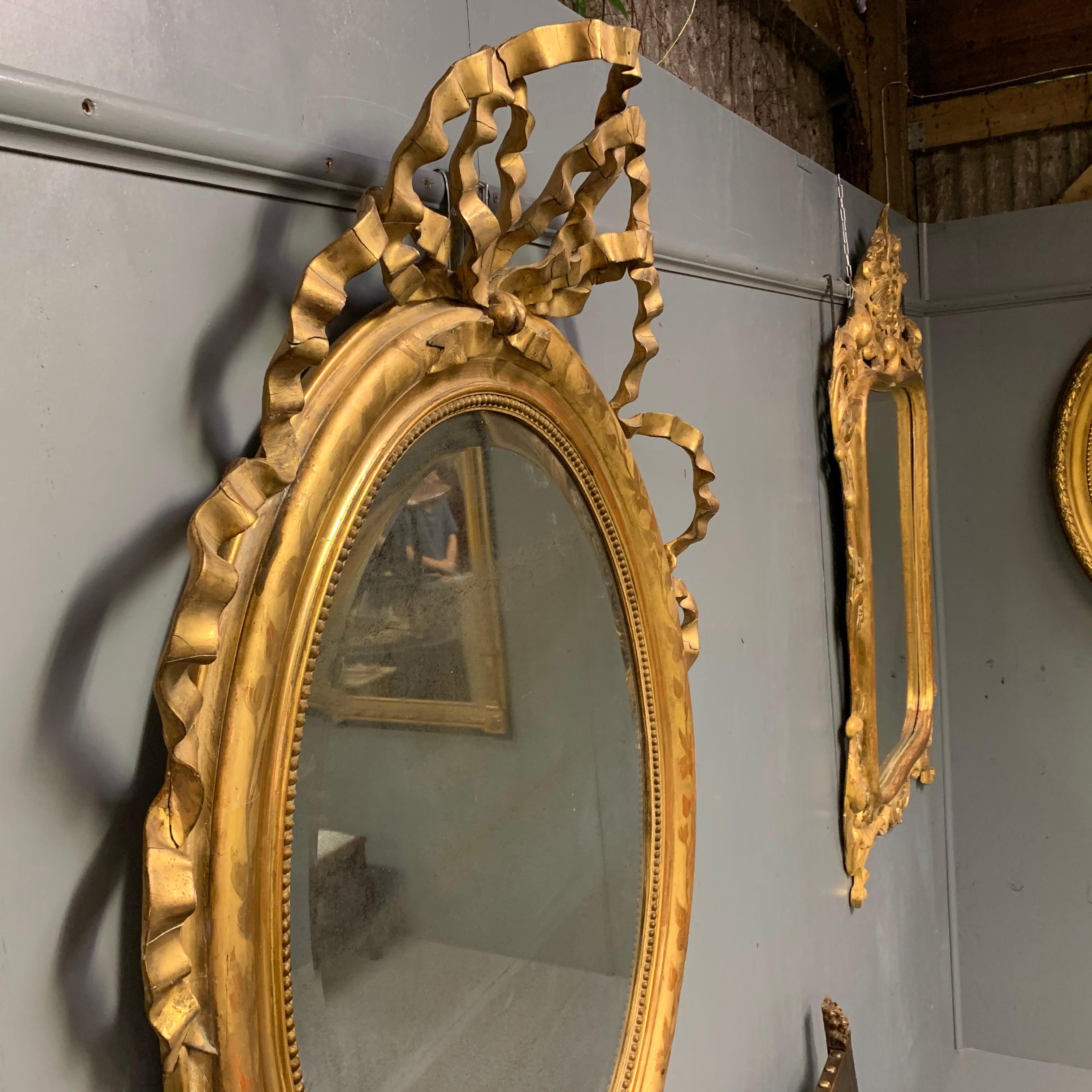 Mid-19th Century Large French Oval Gilt Mirror with Ribbon Cartouche In Good Condition In Uppingham, Rutland