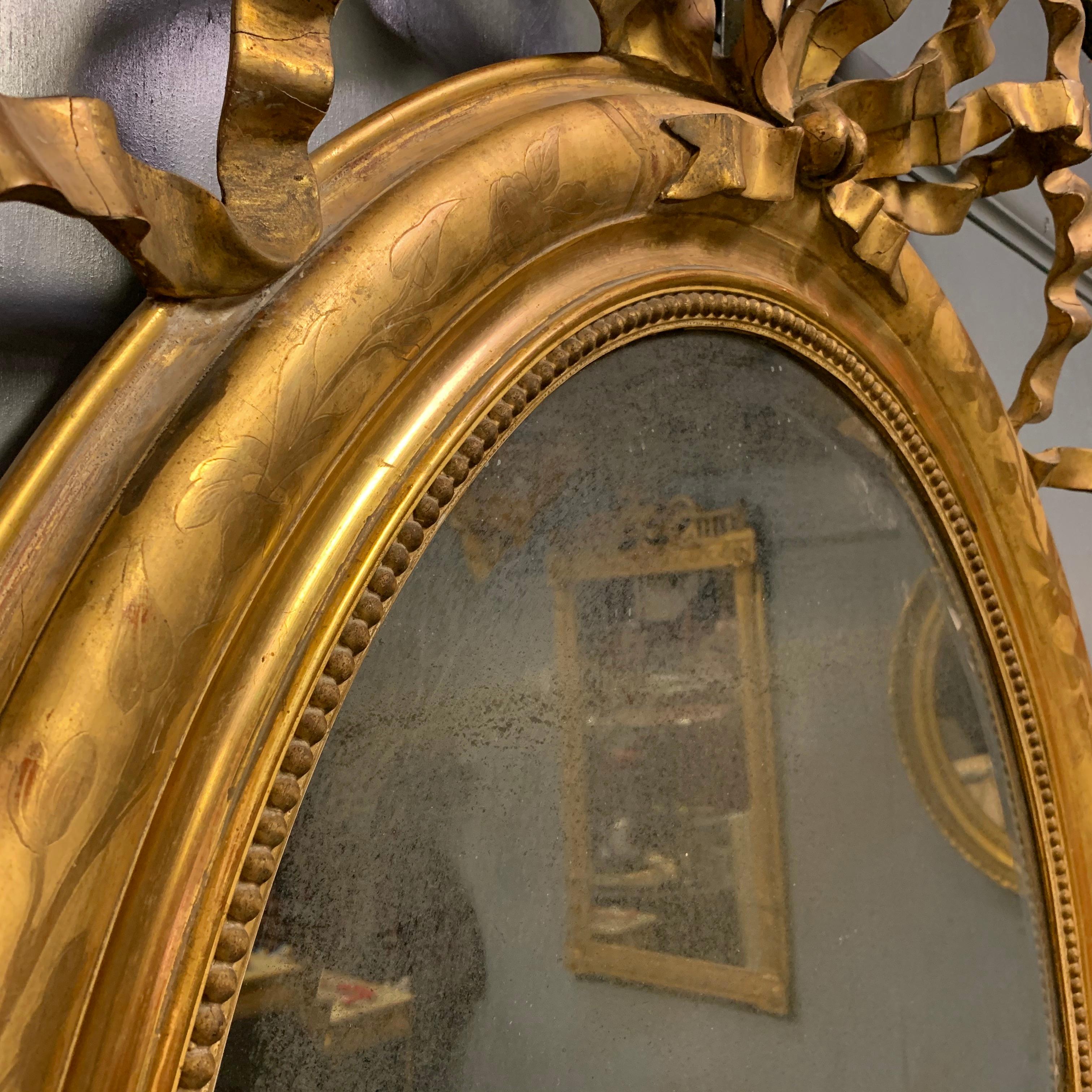 Mid-19th Century Large French Oval Gilt Mirror with Ribbon Cartouche 1