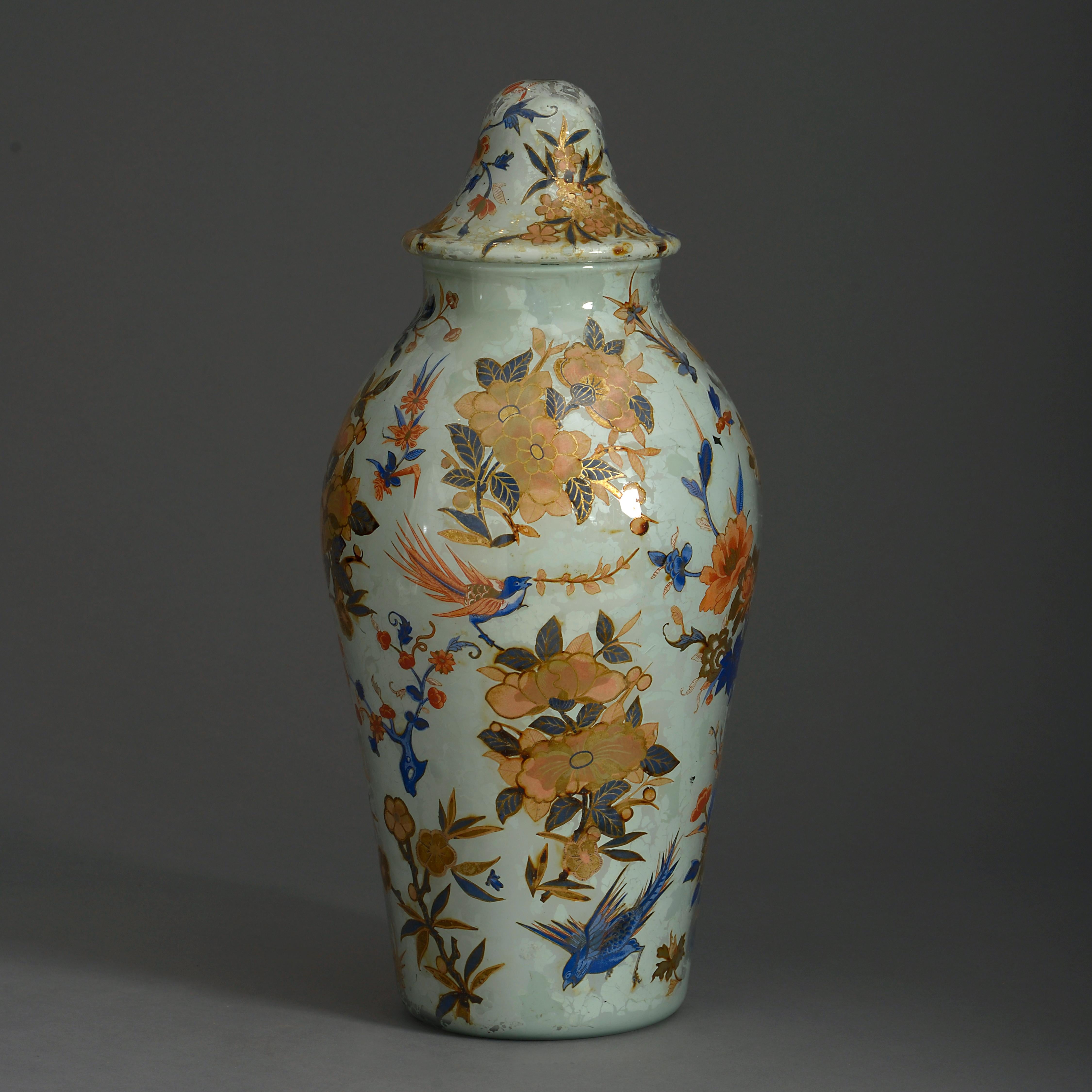 A fine mid-19th century lidded glass decalcomania vase, internally decorated with hand-colored chinoiserie decoupage upon a stone ground.