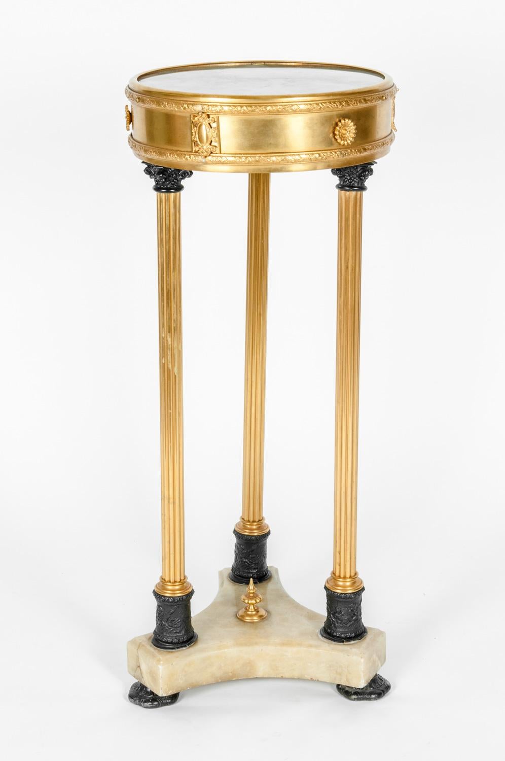 Mid-19th century Louis XVI style side table with onyx and gilt bronze. Two-tier end table with marble base. The table is in excellent condition. The table measure 12 inches top diameter x 29 inches high.