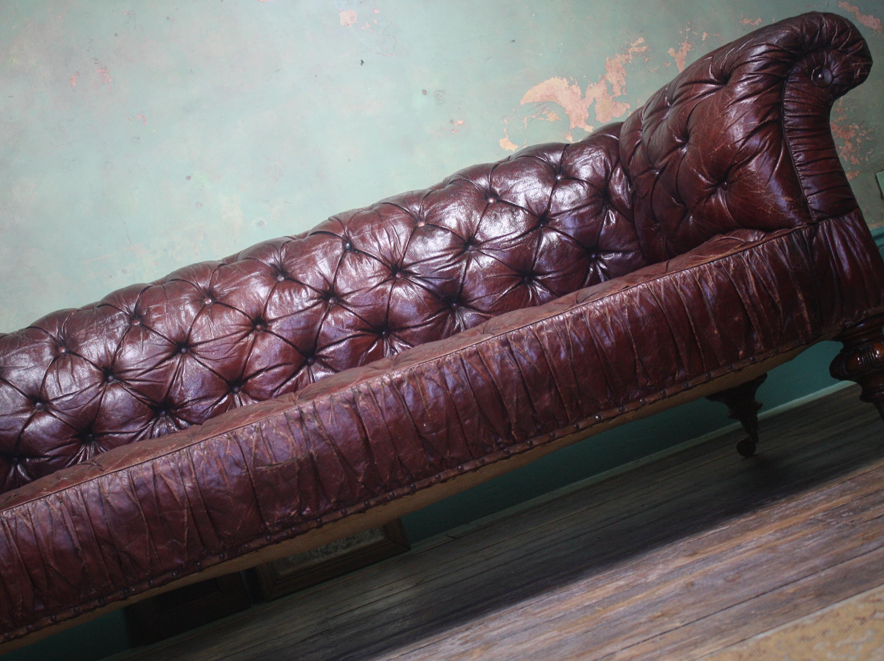 A sumptuous red leather button sofa by Mackenzie & Mitchell (formally Mackenzie & Crosbie) Once of 129 princes street Edinburgh.

The sofa is in perfect country house condition, with wear in all the correct places, some minor elderly leather