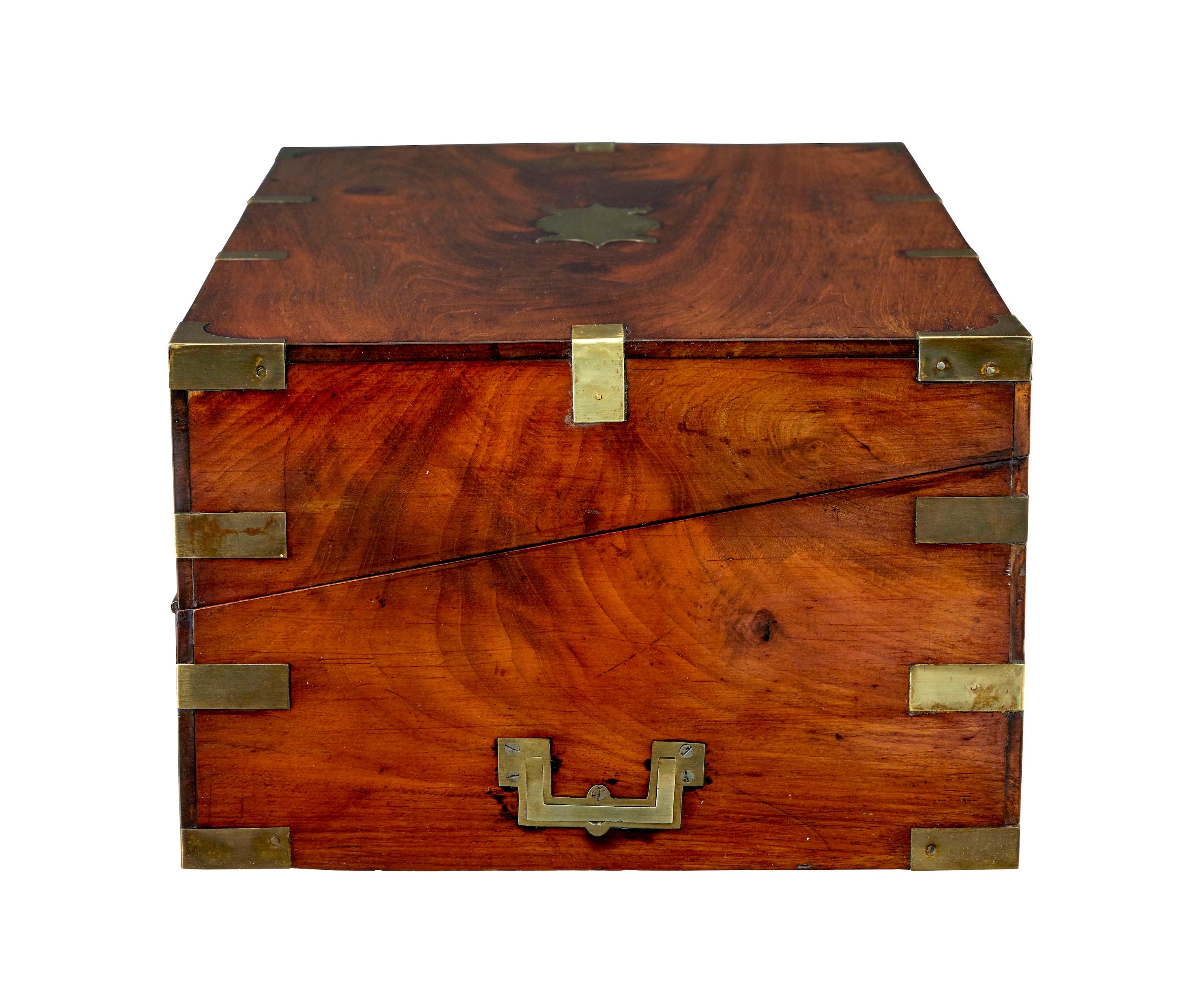 Mid 19th century mahogany brass bound campaign writing slope circa 1860.

Good quality military-campaign writing slope, with secret compartments.

Rectangular shaped box with brass strapping and corner braces, blank cartouche on the lid and around