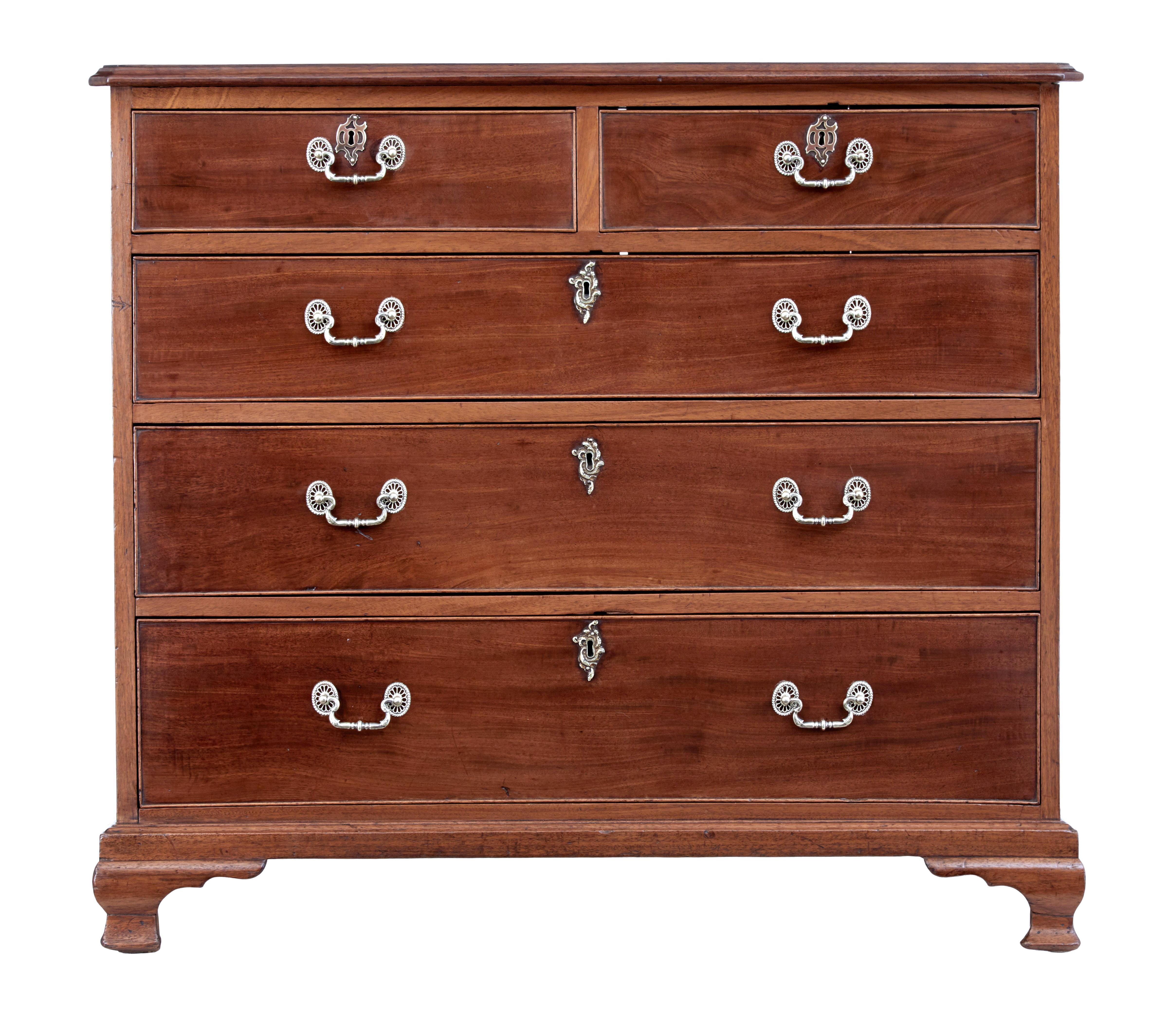 Mid 19th century mahogany chest of drawers circa 1850.

Functional piece of everyday furniture for the home. 2 over 3 graduating drawers fitted with later ornate handles and escutheons. Drawer fronts with original cock beaded edge.

Standing on