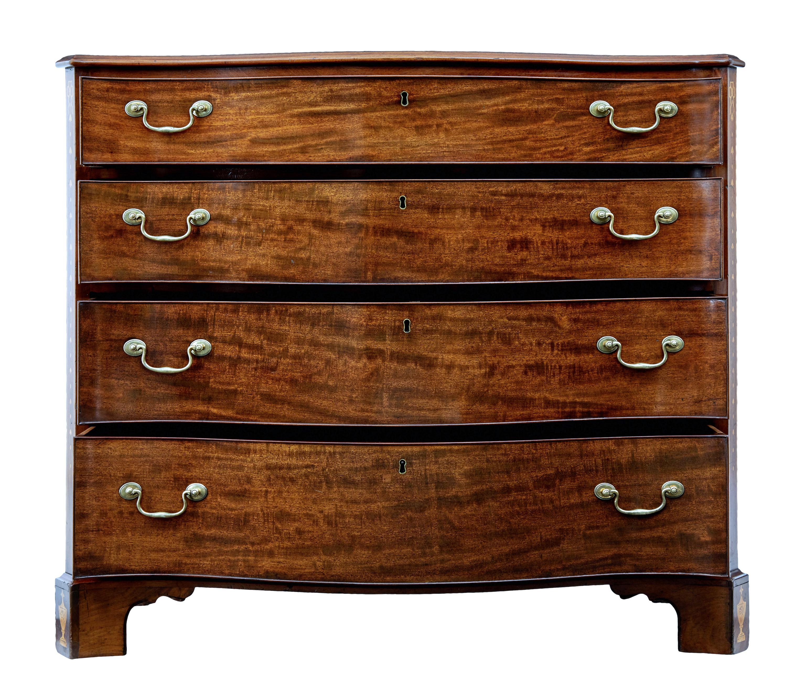 Fine quality serpentine chest of drawers with inlay, circa 1850.

Elegant piece of design with this rich mahogany chest of drawers. Serpentine front and shaped top surface. Canted corners with satinwood inlay design with stringing. Further inlaid