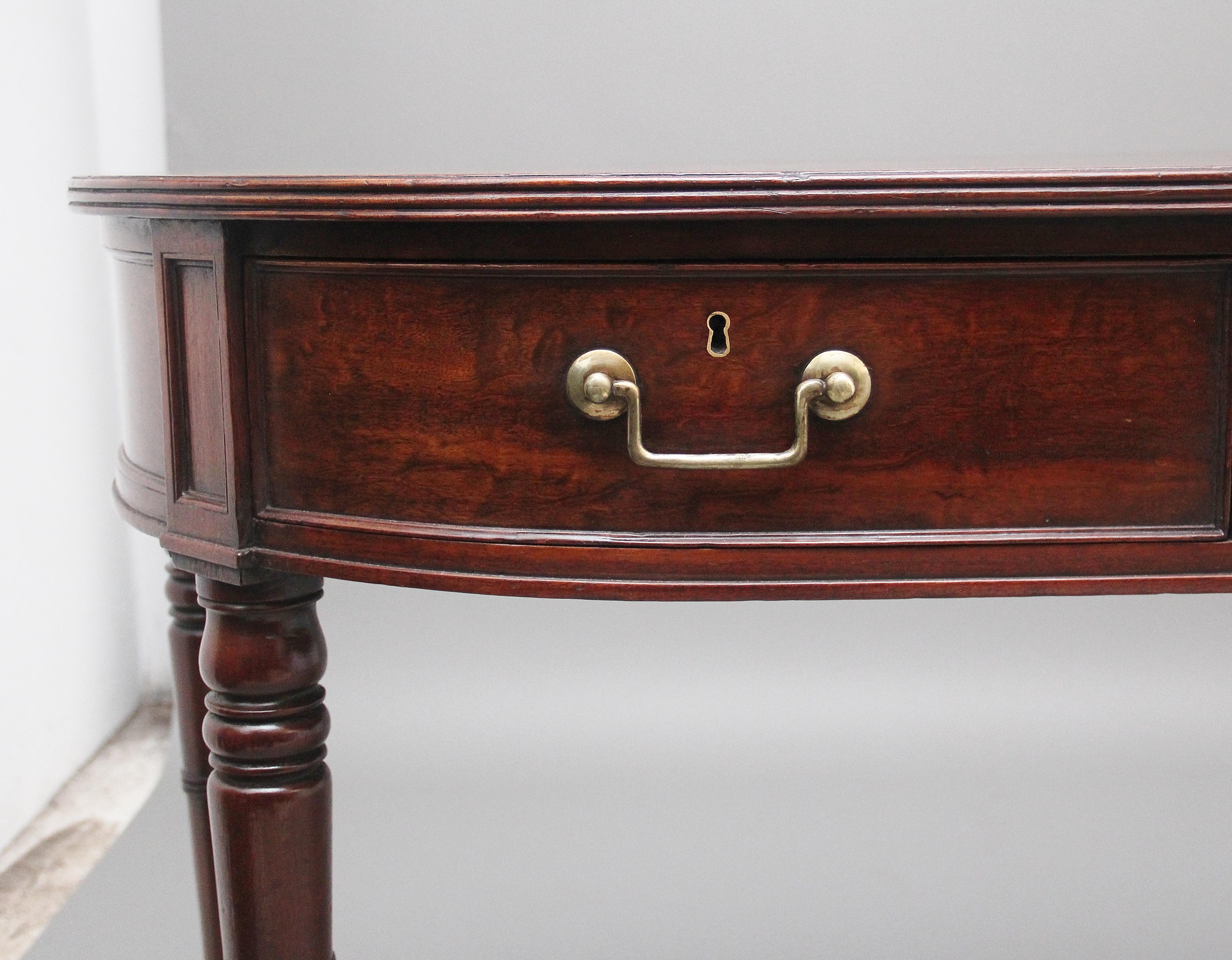 19th century mahogany serving table of a D shape, having a nice figured top with a reeded edge, three frieze drawers below with the original brass handles, supported on ring turned legs. Stamped “H. Mawer & Stephenson, Ltd” on each drawer. circa