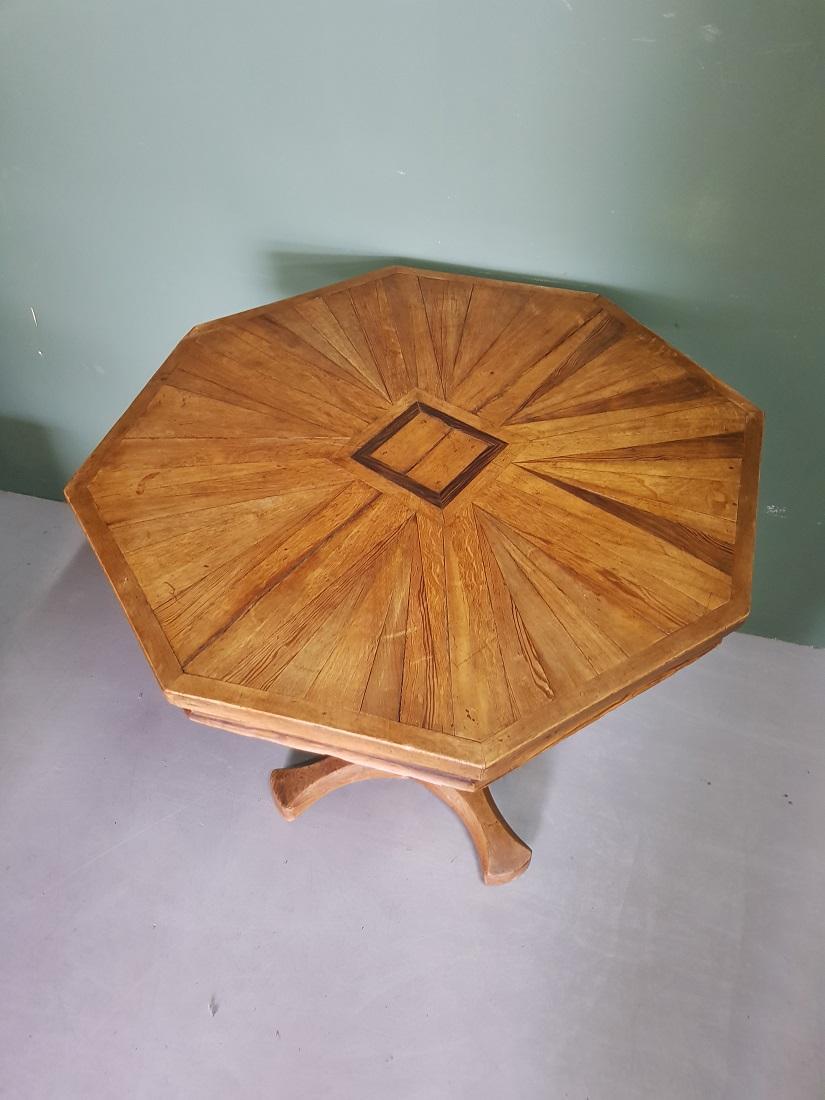 Antique mahogany 8-sided wine table inlaid with coromandel wood and standing on a cross leg and is in good condition with light user marks, mid-19th century. 

The measurements are,
Depth 75 cm/ 29.5 inch.
Width 78 cm/ 30.7 inch.
Height wide 71