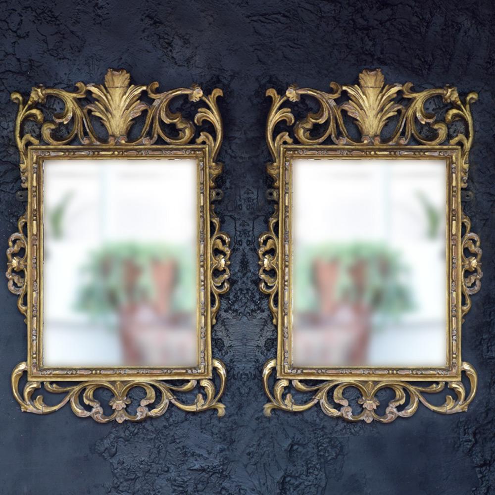 Mid-19th century matched pair of hand carved pine mirrors 

Completely in original condition, Hand carved individually with some loss and aged repairs as you may expect. The style suggests Italian in origin, a highly decorative statement piece for