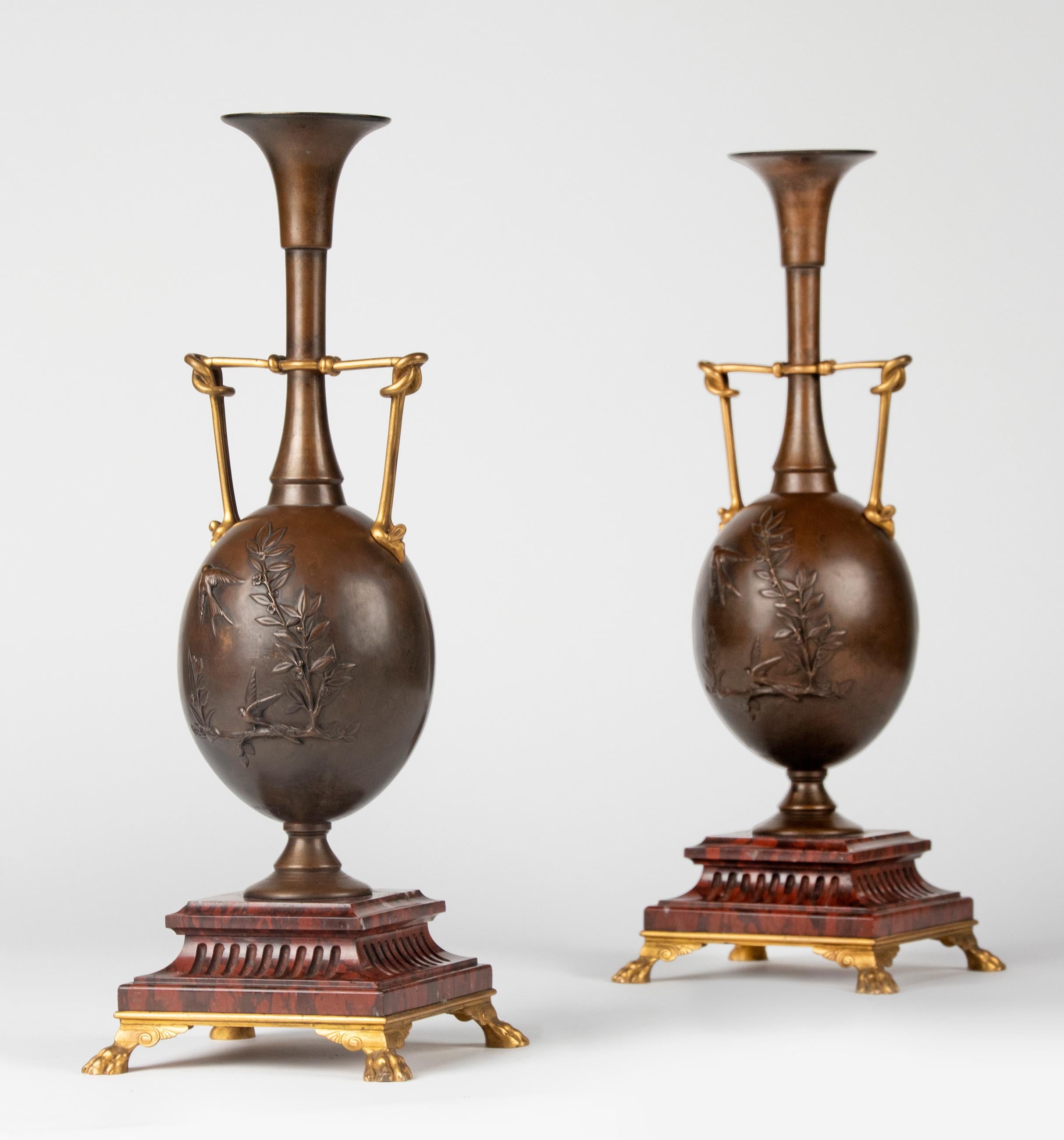A fine pair of French ormolu and patinated bronze vases, baluster shaft with relief decoration of swallows and vegetation. Both artist names are signed, Henry Cahieux (1825-1854) and Ferdinand Barbedienne (1810-1892). Cahieux and Barbedienne one of